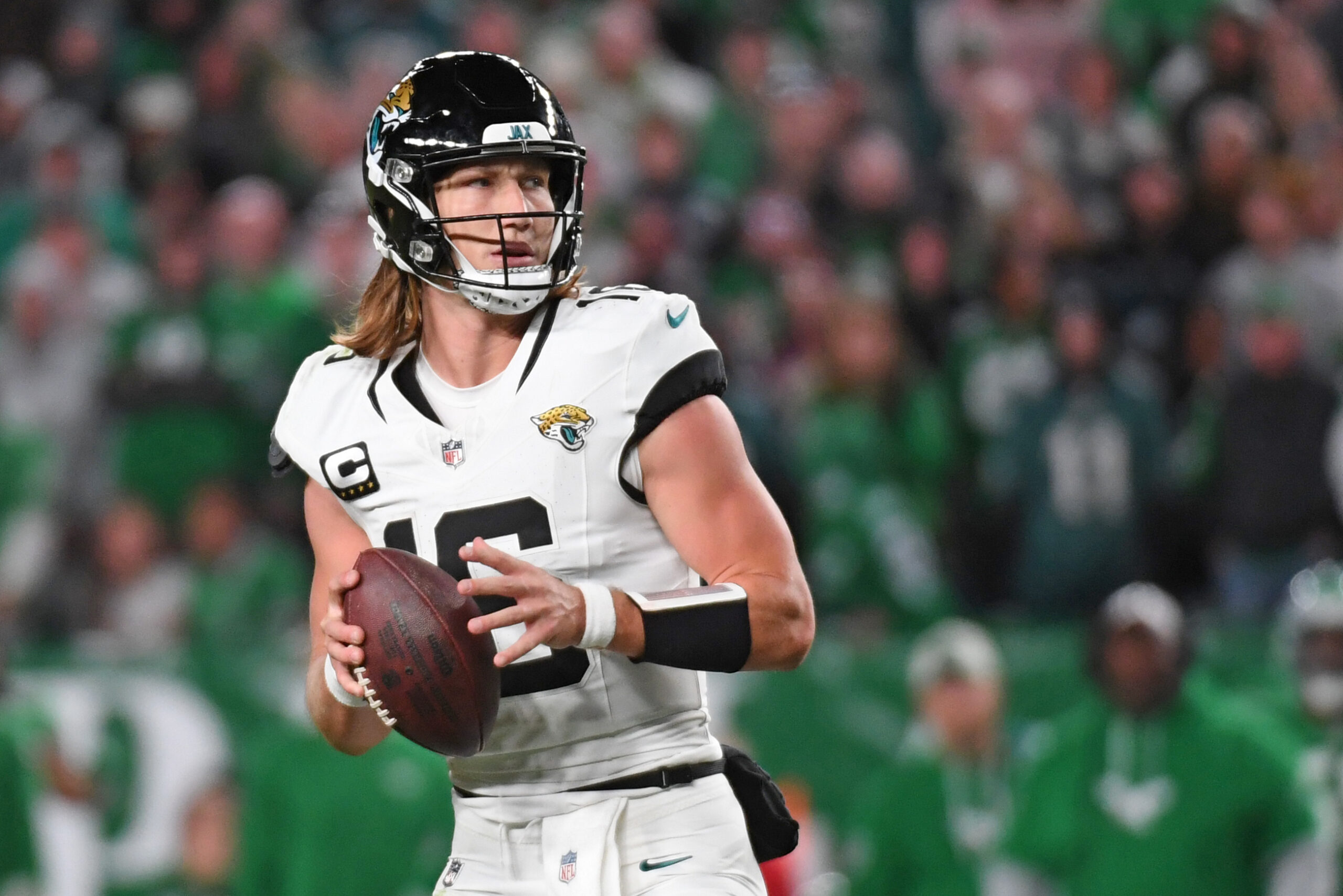 Dec 19, 2020; Charlotte, NC, USA; Clemson Tigers quarterback Trevor Lawrence (16) runs in the second quarter at Bank of America Stadium.