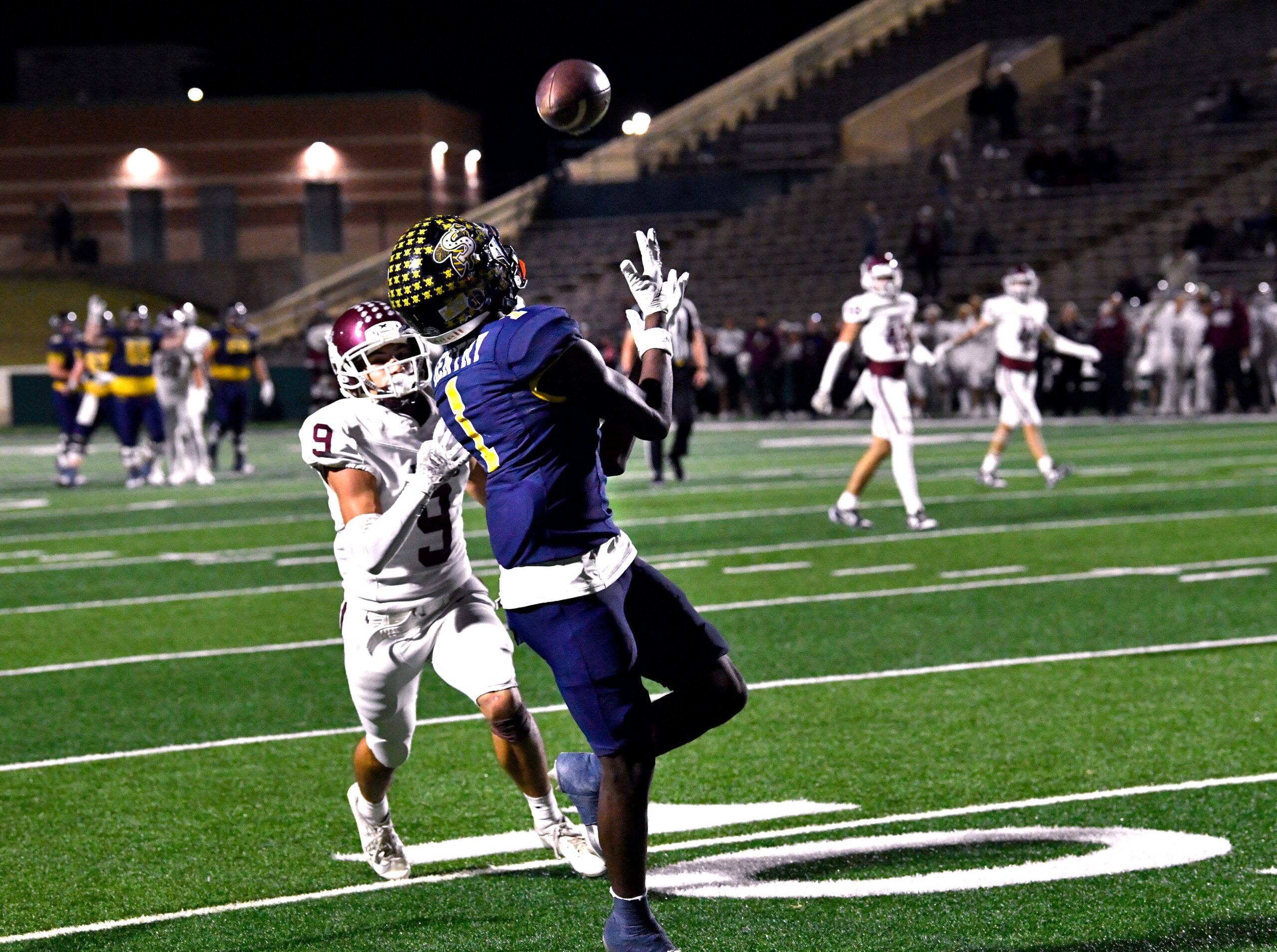Stephenville wide receiver Tristian Gentry makes a successful catch, carrying the ball away from Hereford defensive back Anthony Mendoza and into the end zone for a touchdown during Thursday’s Class 4A Div. I playoff game at Shotwell Stadium in Abilene Nov. 21, 2024. Final score was 35-7, Stephenville.