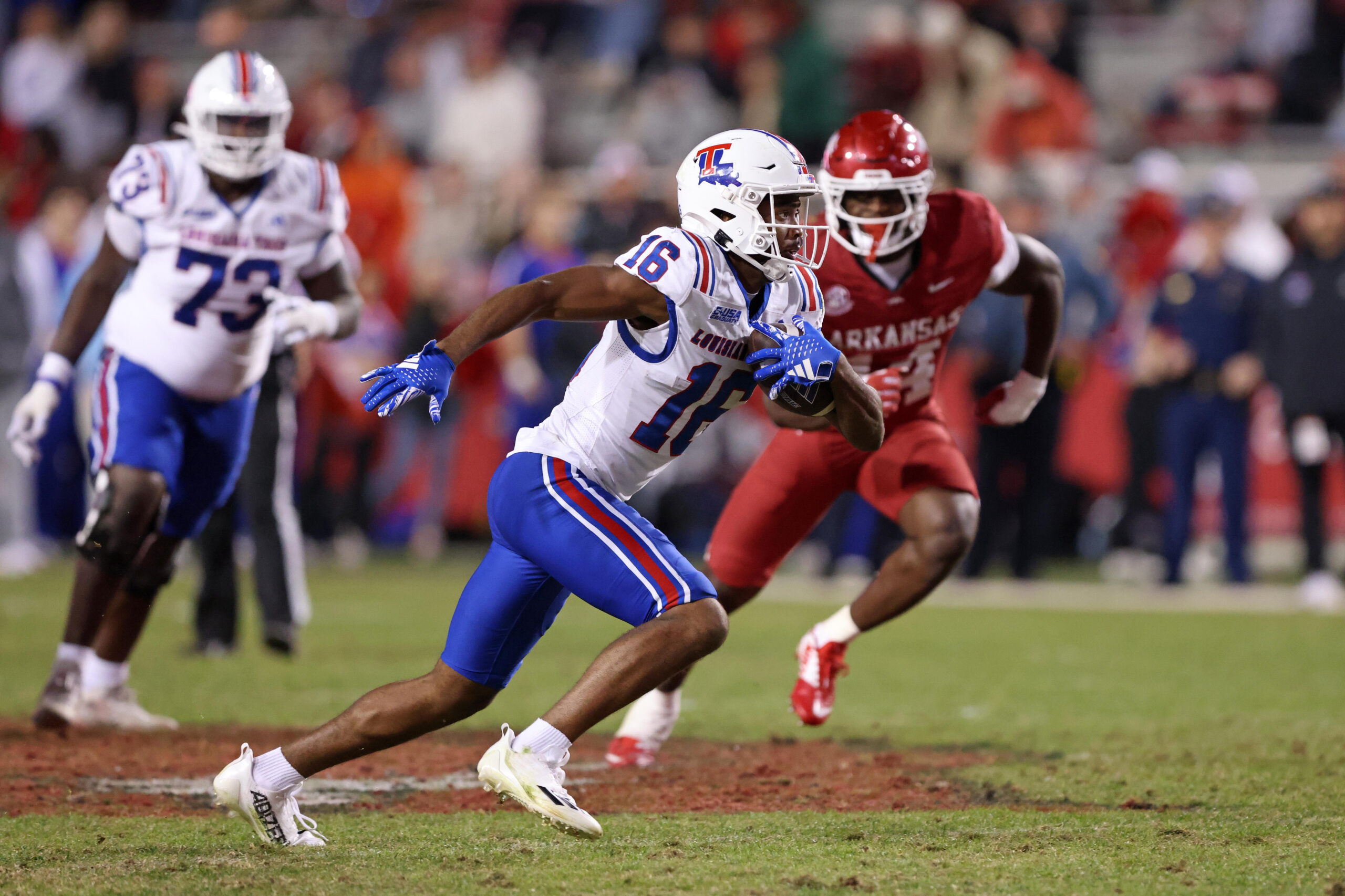 Nov 23, 2024; Fayetteville, Arkansas, USA; Louisiana Tech Bulldogs wide receiver Tru Edwards (16) runs after a catch in the fourth quarter against the Arkansas Razorbacks at Donald W. Reynolds Razorback Stadium. Arkansas won 35-14.