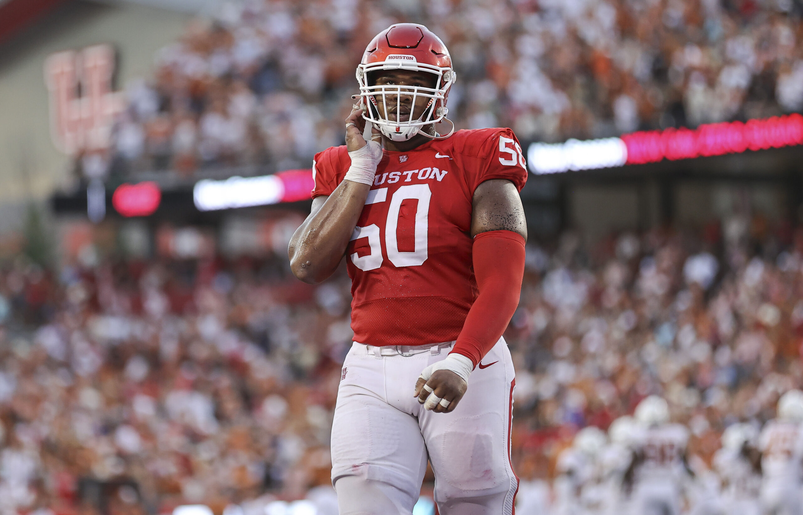 Oct 21, 2023; Houston, Texas, USA; Houston Cougars offensive lineman Tyler Johnson (50) walks off the field after a play during the fourth quarter against the Texas Longhorns at TDECU Stadium.