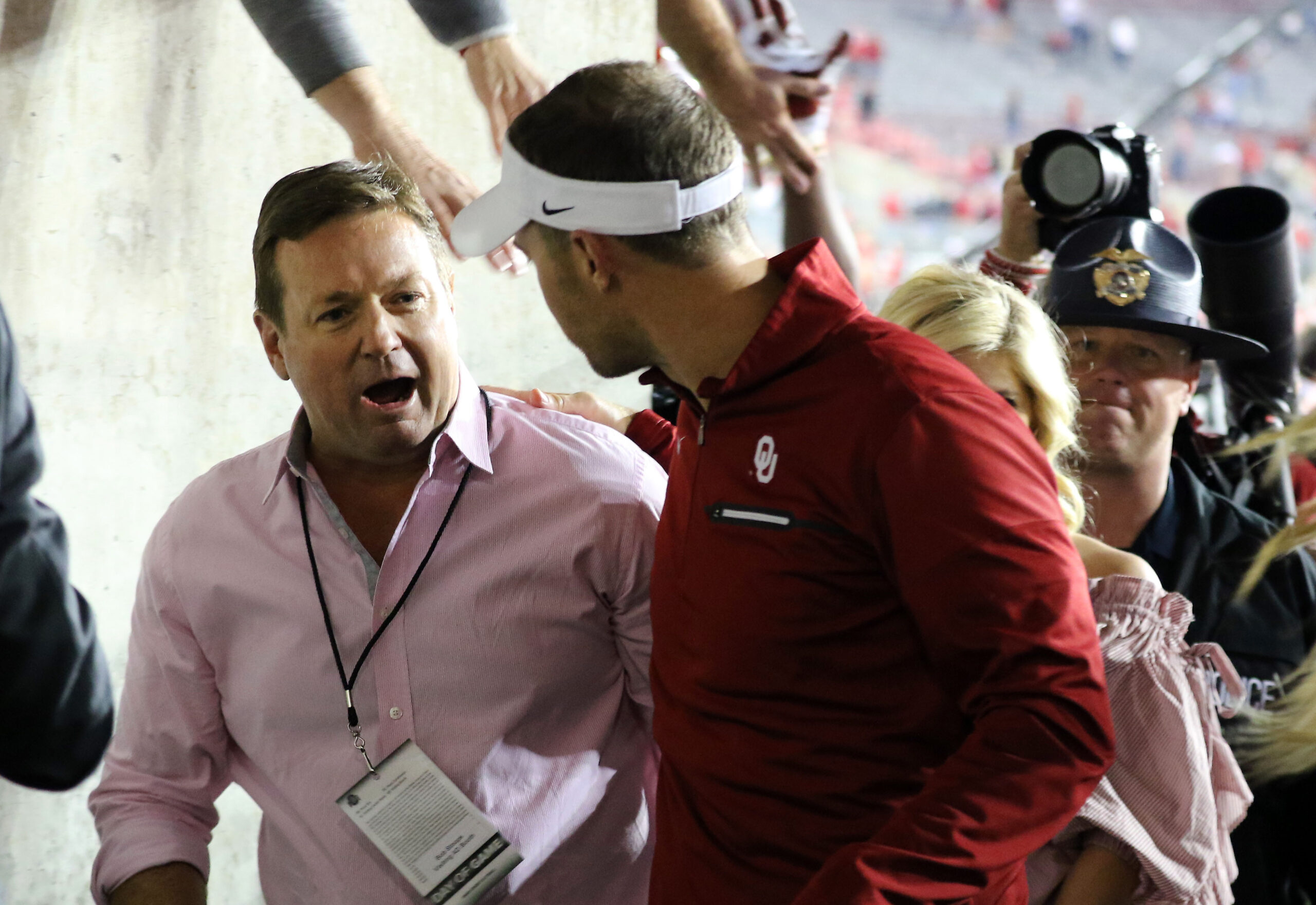 Sep 9, 2017; Columbus, OH, USA; Oklahoma Sooners former head coach Bob Stoops congratulates current Sooner head coach Lincoln Riley following the game against the Ohio State Buckeyes at Ohio Stadium. The Oklahoma Sooners won the game 31-16.