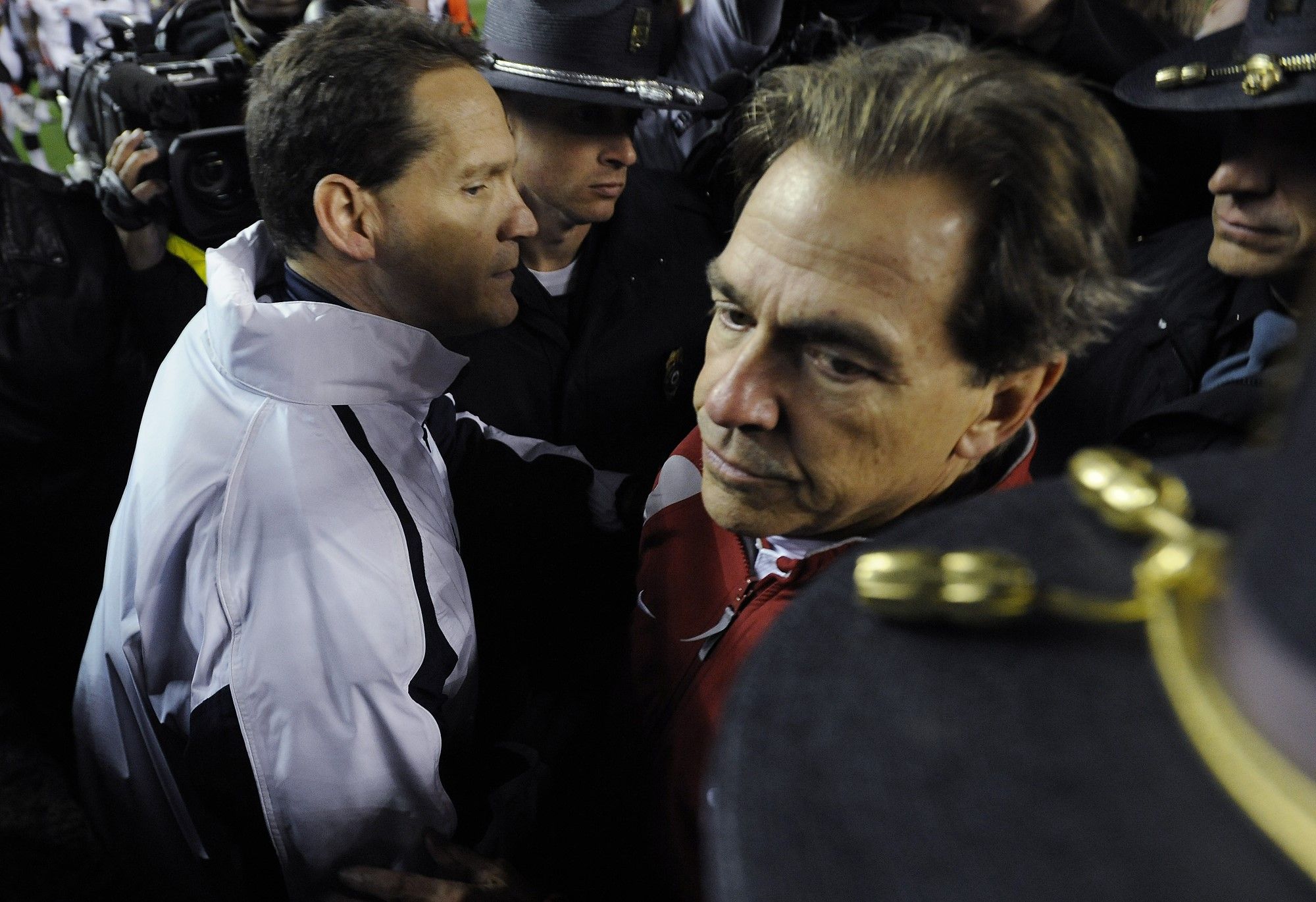 Alabama Coach Nick Saban hugs Auburn Coach Gene Chizik following the Iron Bowl at Bryant-Denny Stadium in Tuscaloosa, Ala. on Saturday November 24, 2012.