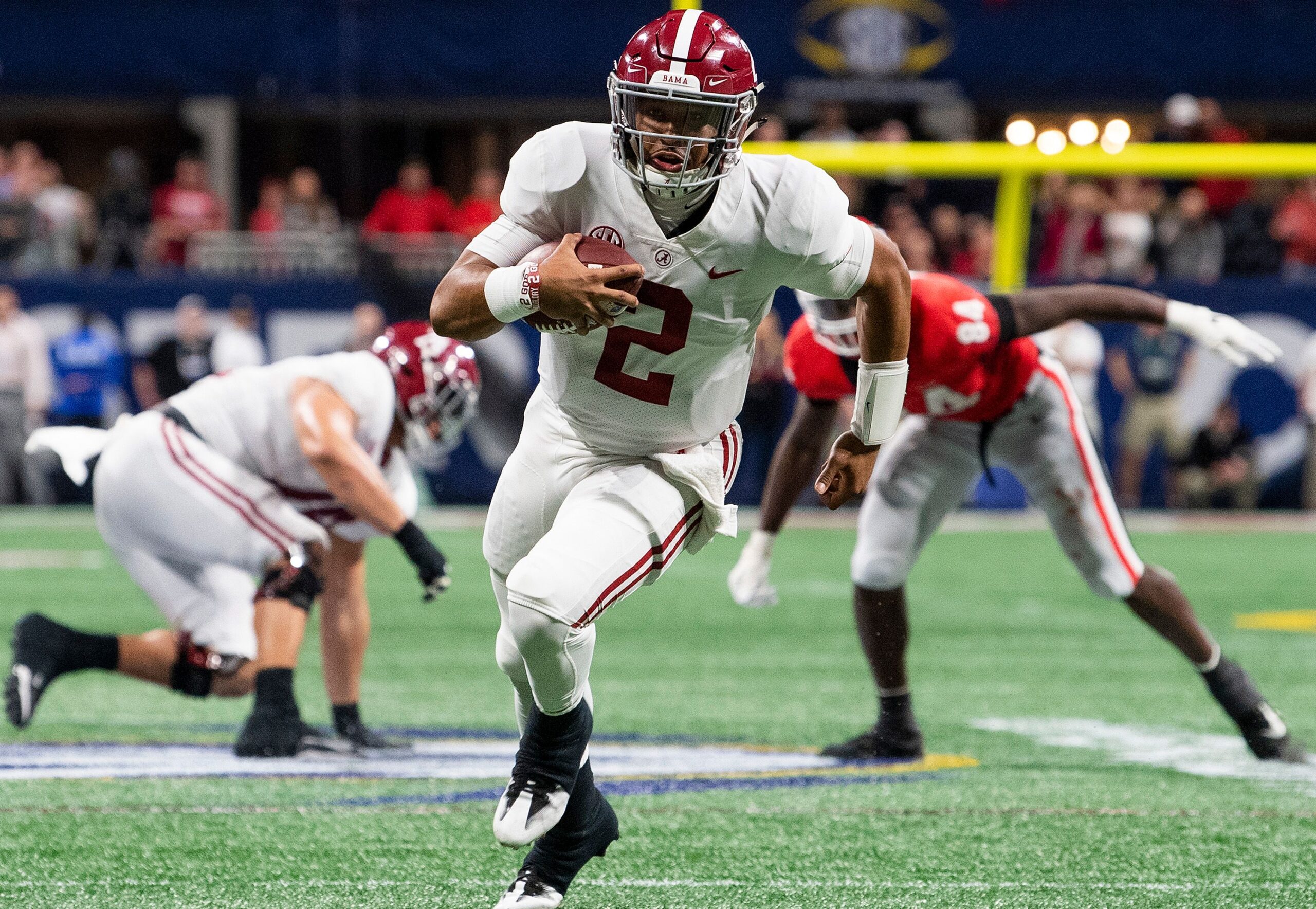 Alabama quarterback Jalen Hurts (2) carries for the go ahead touchdown against Georgia in the SEC Championship Game at Mercedes Benz Stadium in Atlanta, Ga., on Saturday December 1, 2018. 
