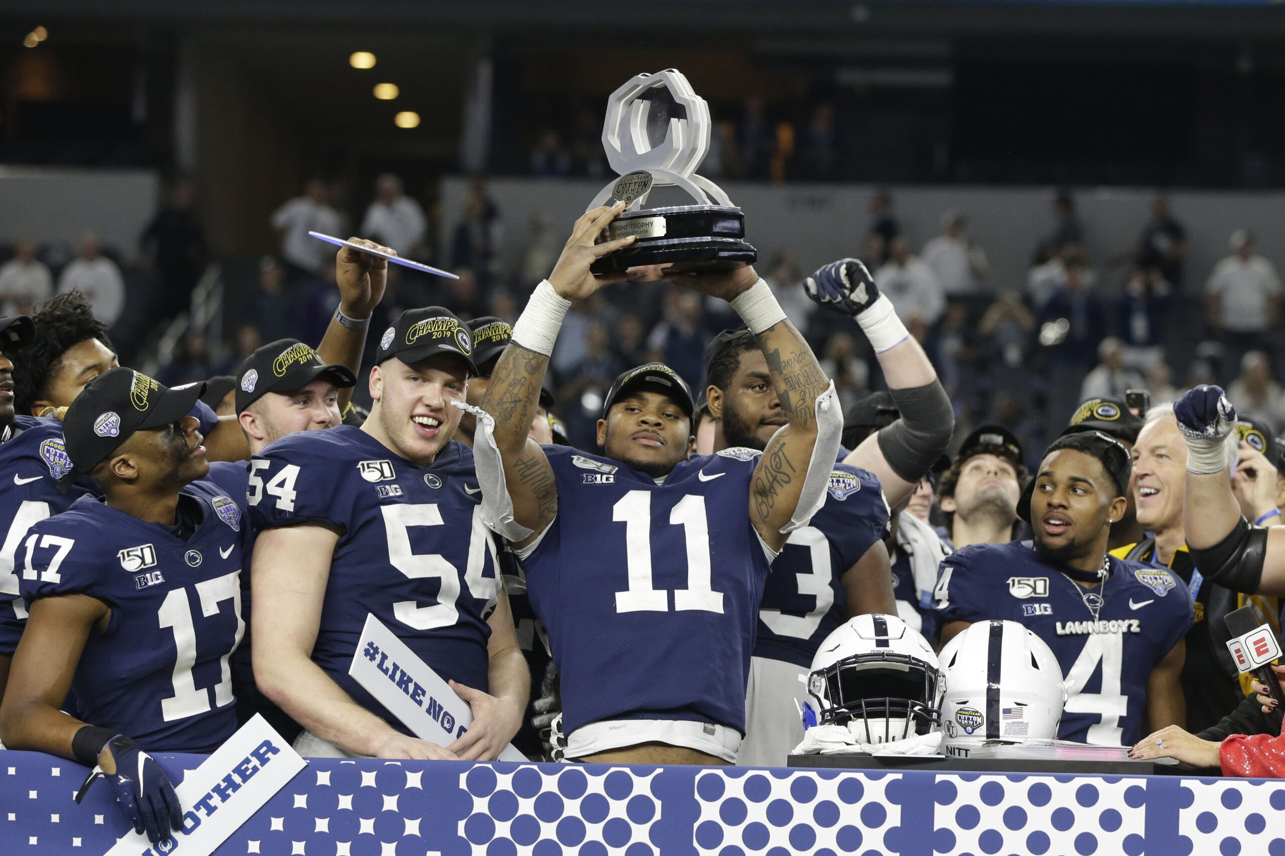Dec 28, 2019; Arlington, Texas, USA; Penn State Nittany Lions linebacker Micah Parsons (11) holds up the most outstanding defensive player award after the game against the Memphis Tigers at AT&T Stadium.