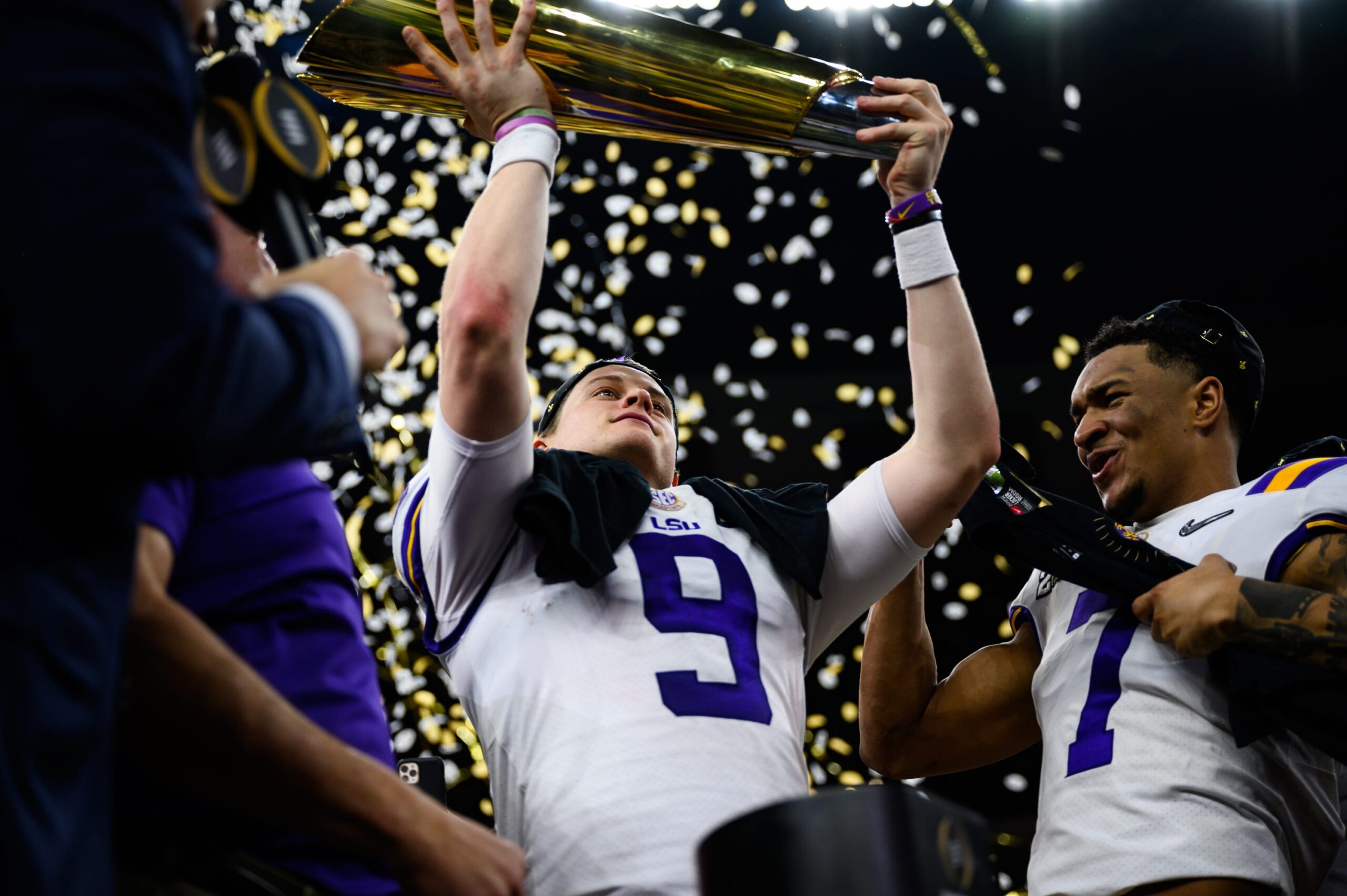LSU quarterback Joe Burrow (9) holds up the trophy after their victory against Clemson at the College Football National Championship game at the Mercedes Benz Superdome Monday, Jan. 13, 2020. Jm Championship 011320 043