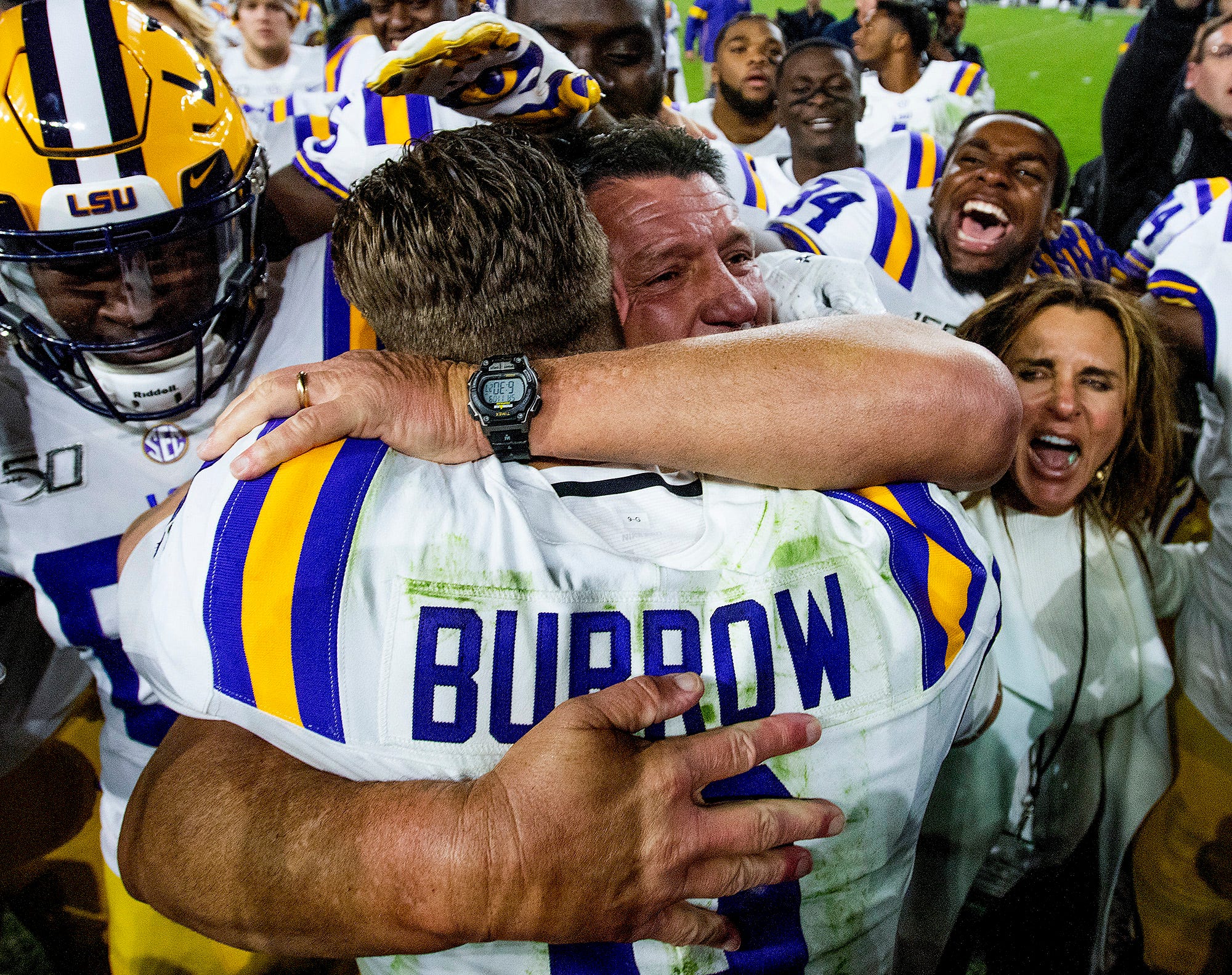 LSU head coach Ed Orgeron hugs quarterback Joe Burrow (9) after defeating Alabama at Bryant-Denny Stadium in Tuscaloosa, Ala., on Saturday November 9, 2019.