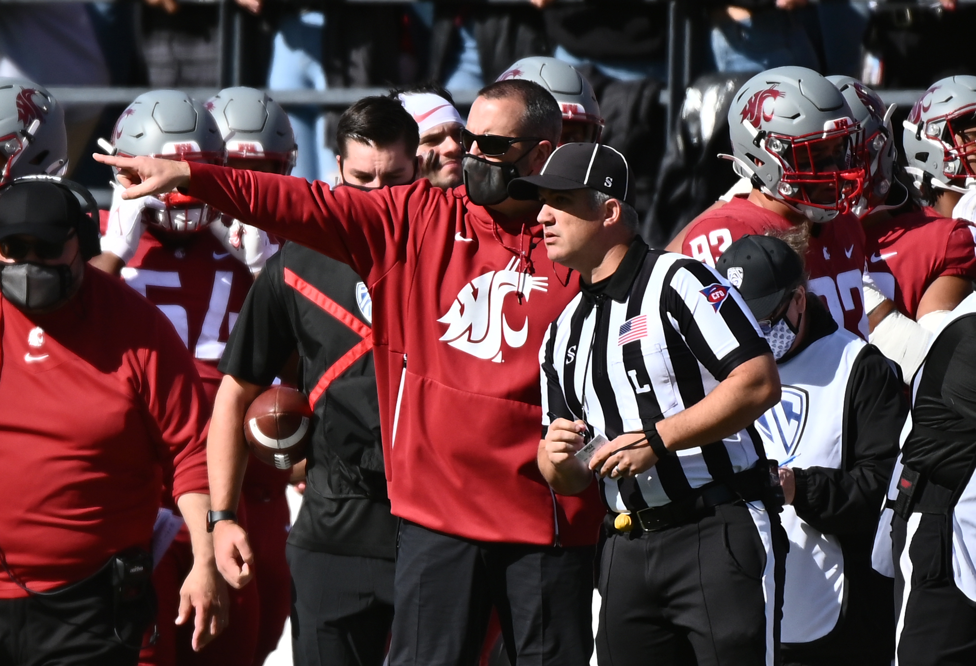Oct 9, 2021; Pullman, Washington, USA; Washington State Cougars head coach Nick Rolovich talks with an official during a game against the Oregon State Beavers in the first half at Gesa Field at Martin Stadium.