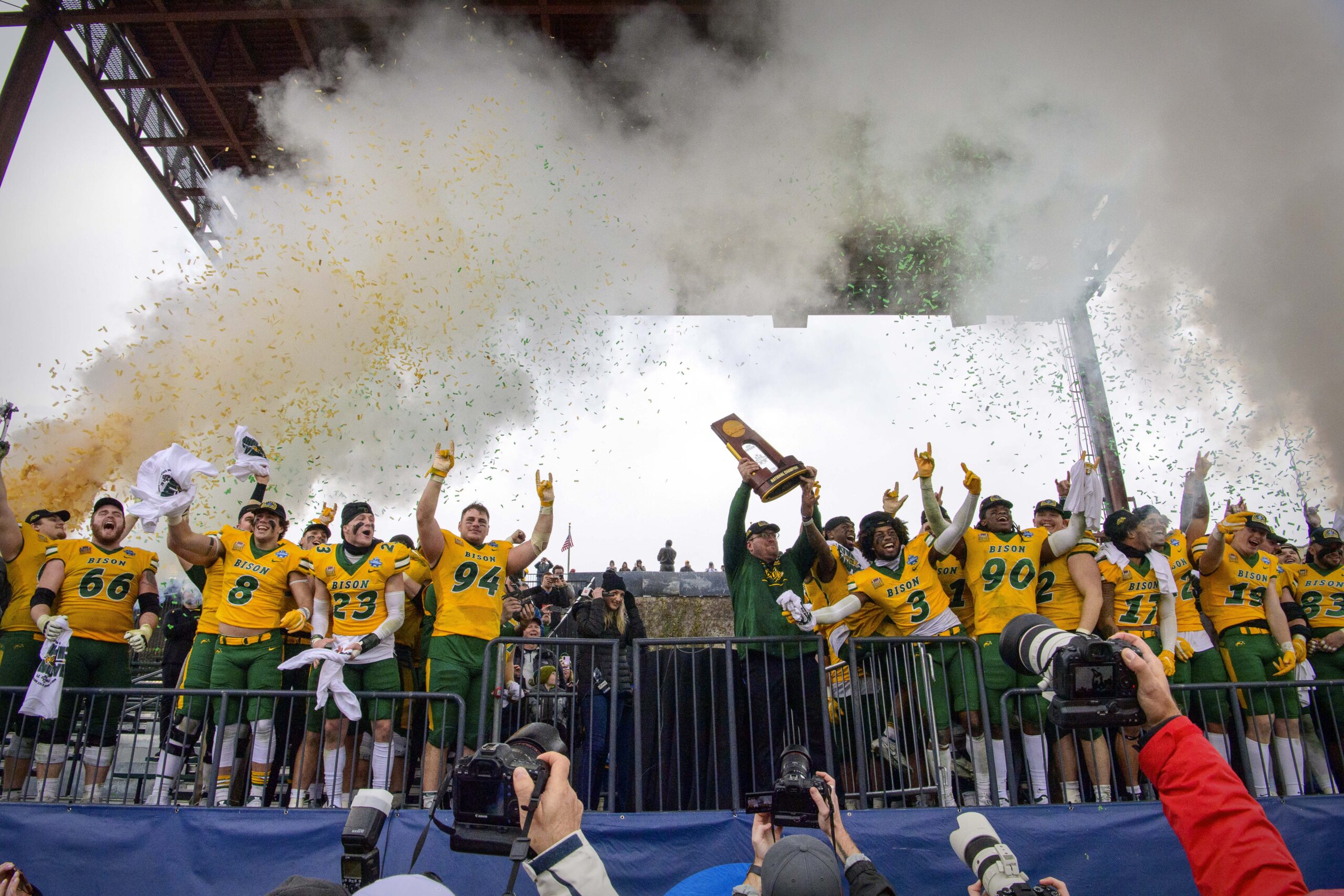 Jan 8, 2022; Frisco, TX, USA; North Dakota State Bison head coach Matt Entz holds up the championship trophy as the Bison celebrate the win over the Montana State Bobcats in the FCS Championship at Toyota Stadium.