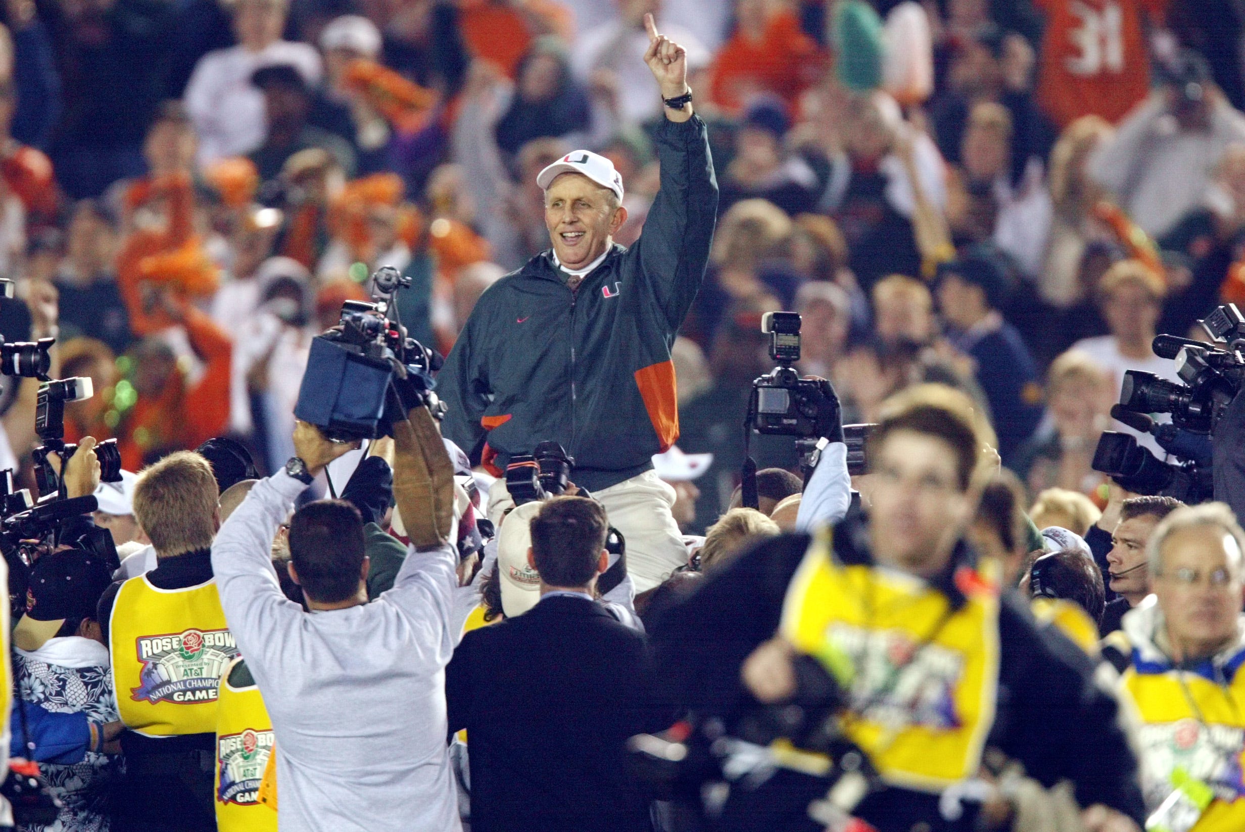 Miami head coach Larry Coker rides on his players' shoulders after the Hurricanes defeated Nebraska to win the 2001 national championship