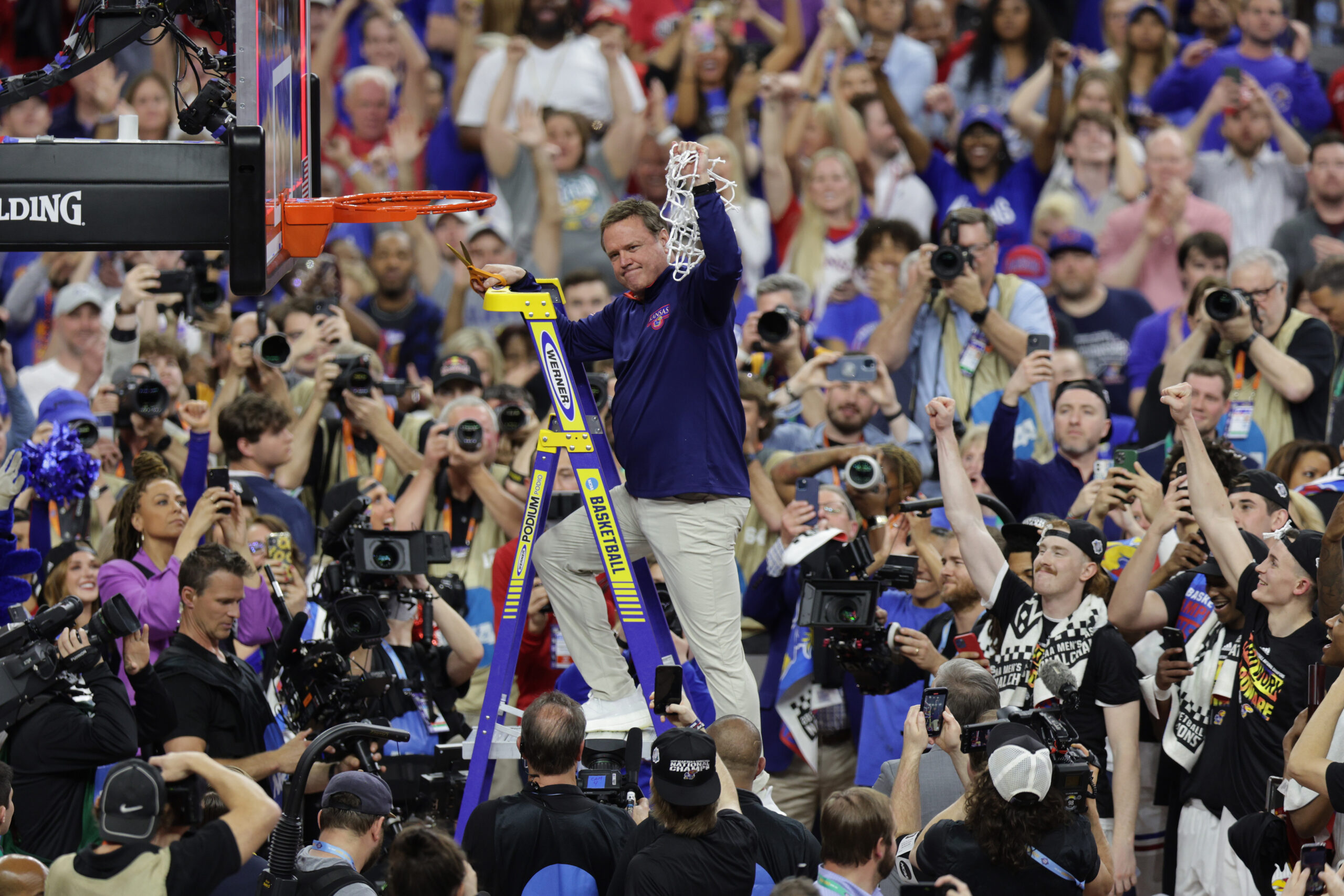 Apr 4, 2022; New Orleans, LA, USA; Kansas Jayhawks head coach Bill Self cuts down the net after defeating the North Carolina Tar Heels during the 2022 NCAA men's basketball tournament Final Four championship game at Caesars Superdome.