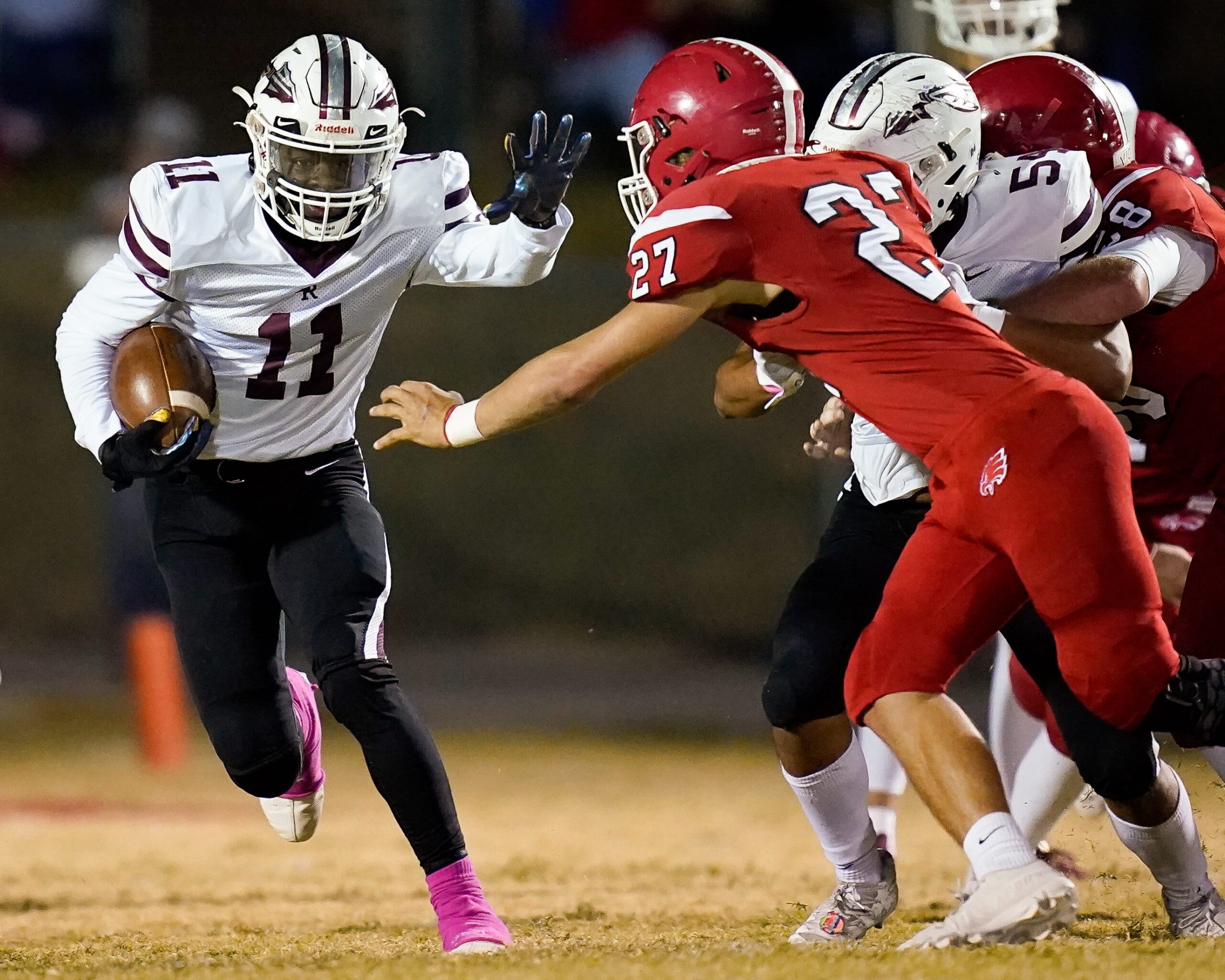 East Robertson's Isaiah Groves (11) evades Westmoreland's Nick Gray (27).