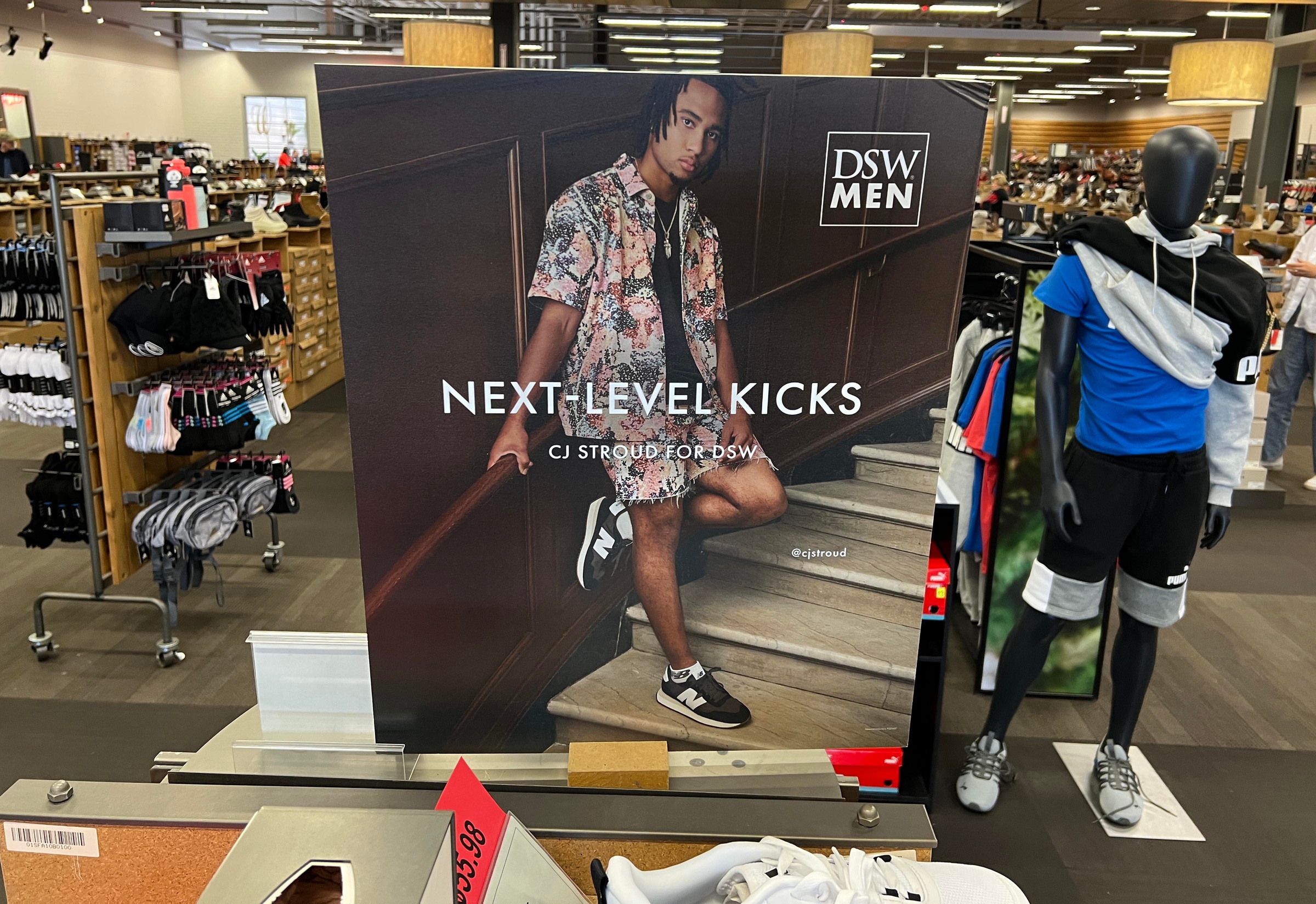 Dec 30, 2022; Columbus, Ohio, USA; C.J. Stroud poster at Designer Shoe Warehouse in Columbus is one of several NIL deals Ohio State athletes have made with Columbus companies.