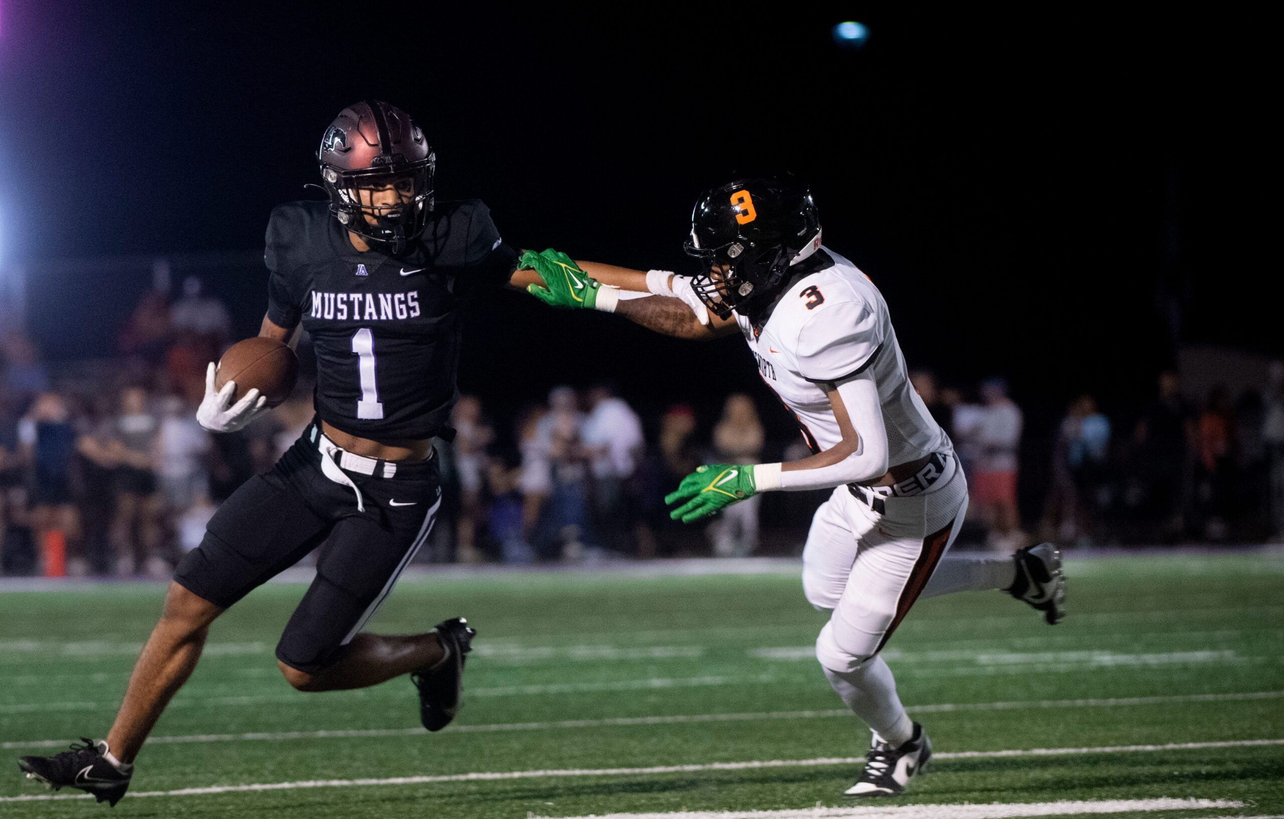 Lipscomb Academy High School s, Kaleb Beasley runs the ball while Ensworth s Jay Johnson defends during the game at Lipscomb Academy High School Football Stadium in Nashville , Tenn., Friday, Sept. 15, 2023.