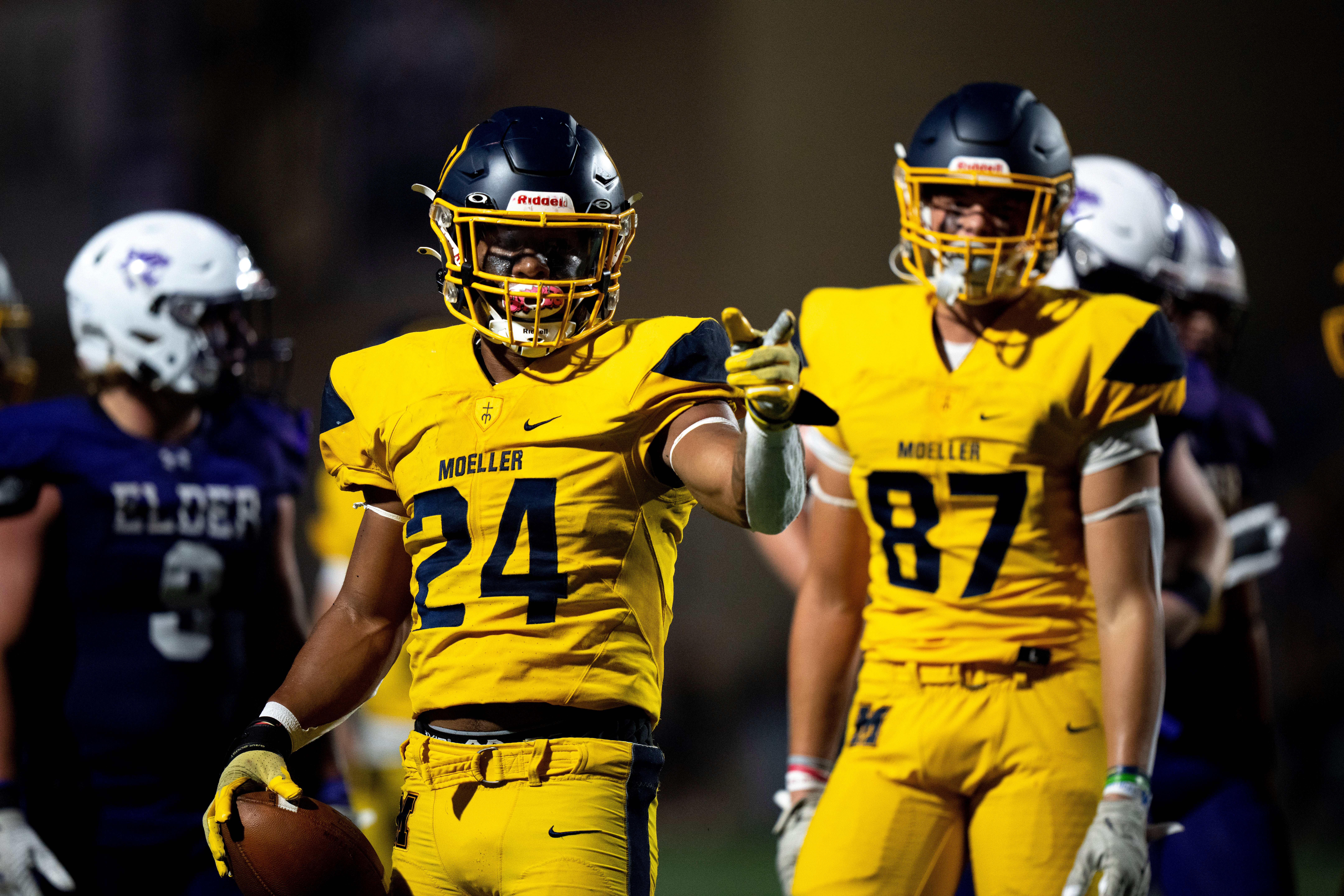 Moeller running back Jordan Marshall (24) points after getting a first down on fourth down in the first half of the OHSAA football game between Moeller High School and Elder High School at The Pit in West Price Hill on Friday, Sept. 29, 2023.  