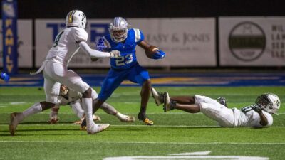 Jackson Christian's Jay'Len Mosley tries to evade Crusader defenders.