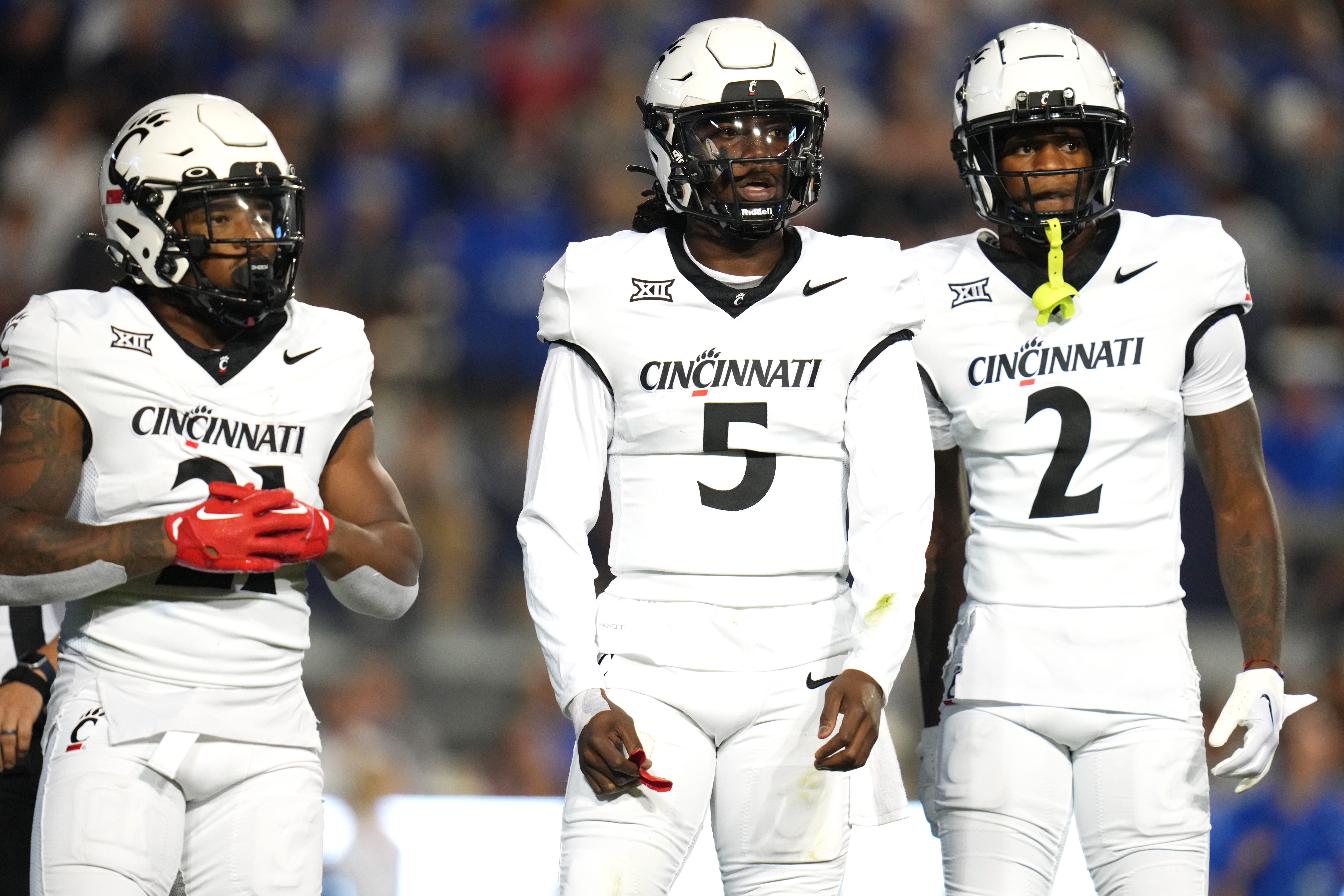 Cincinnati Bearcats running back Corey Kiner (21) Cincinnati Bearcats quarterback Emory Jones (5) and Cincinnati Bearcats wide receiver Dee Wiggins (2), wait for a play call in the first quarter during a college football game between the Brigham Young Cougars and the Cincinnati Bearcats, Friday, Sept. 29, 2023, at LaVell Edwards Stadium in Provo, Utah.