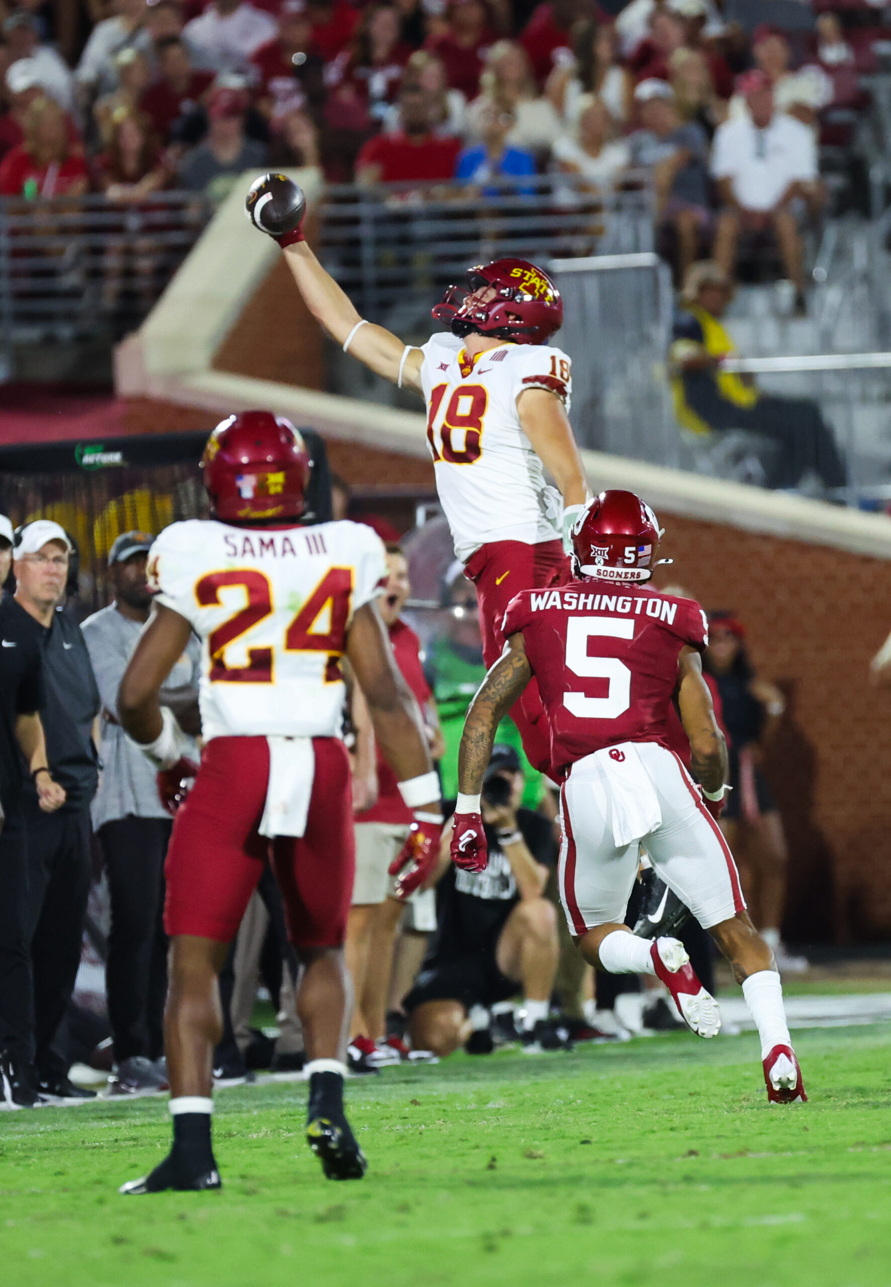 Sep 30, 2023; Norman, Oklahoma, USA; Iowa State Cyclones tight end Benjamin Brahmer (18) makes a catch but is ruled out of bounds as Oklahoma Sooners defensive back Woodi Washington (5) defends during the second half at Gaylord Family-Oklahoma Memorial Stadium.