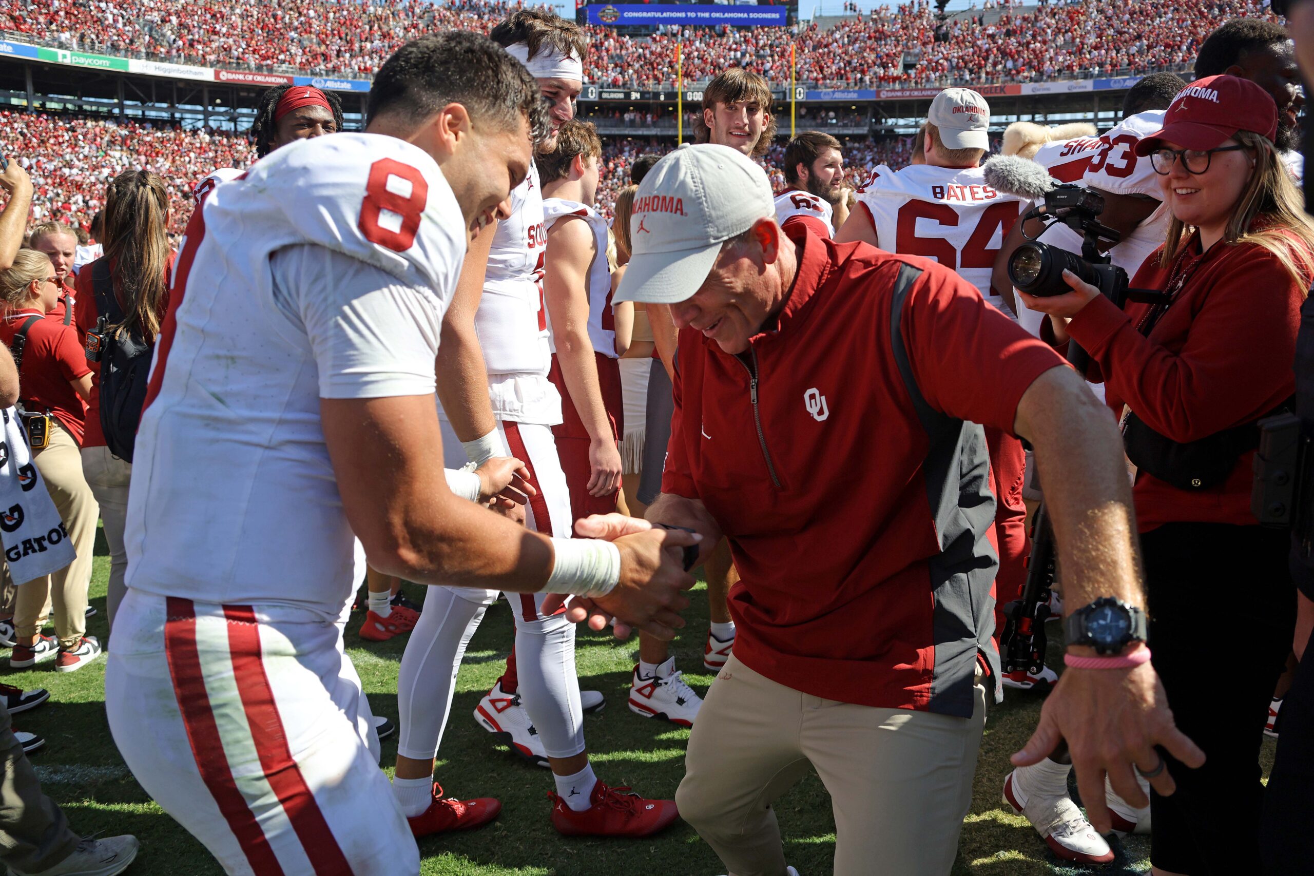 Oklahoma coach Brent Venables celebrates with Oklahoma Sooners quarterback Dillon Gabriel (8) after the Red River Rivalry college football game between the University of Oklahoma Sooners (OU) and the University of Texas (UT) Longhorns at the Cotton Bowl in Dallas, Saturday, Oct. 7, 2023. Oklahoma won 34-30.
