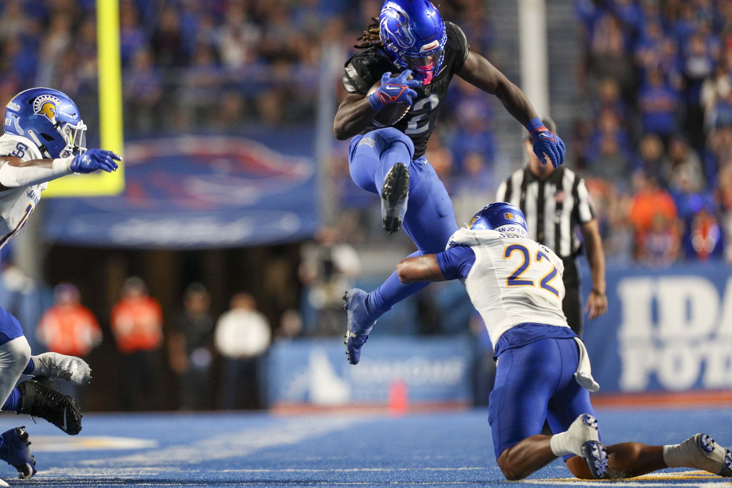 Oct 7, 2023; Boise, Idaho, USA; Boise State Broncos running back Ashton Jeanty (2) jumps over San Jose State Spartans safety Tre Jenkins (22) during the second half at Albertsons Stadium. Boise State defeats San Jose State 35-27.