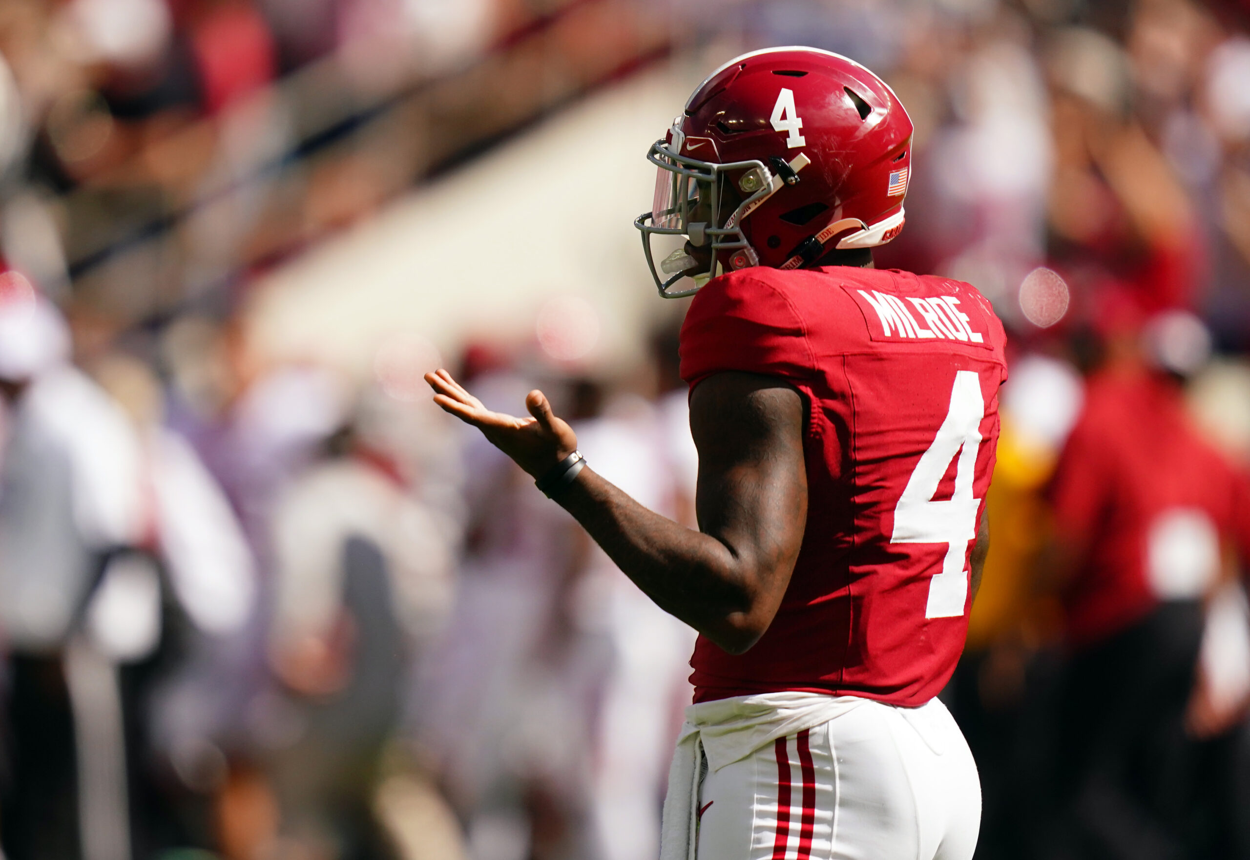 Oct 14, 2023; Tuscaloosa, Alabama, USA; Alabama Crimson Tide quarterback Jalen Milroe (4) reacts to his 79 yard pass for a touchdown during the first quarter against the Arkansas Razorbacks at Bryant-Denny Stadium. Mandatory Credit: John David Mercer-USA TODAY Sport