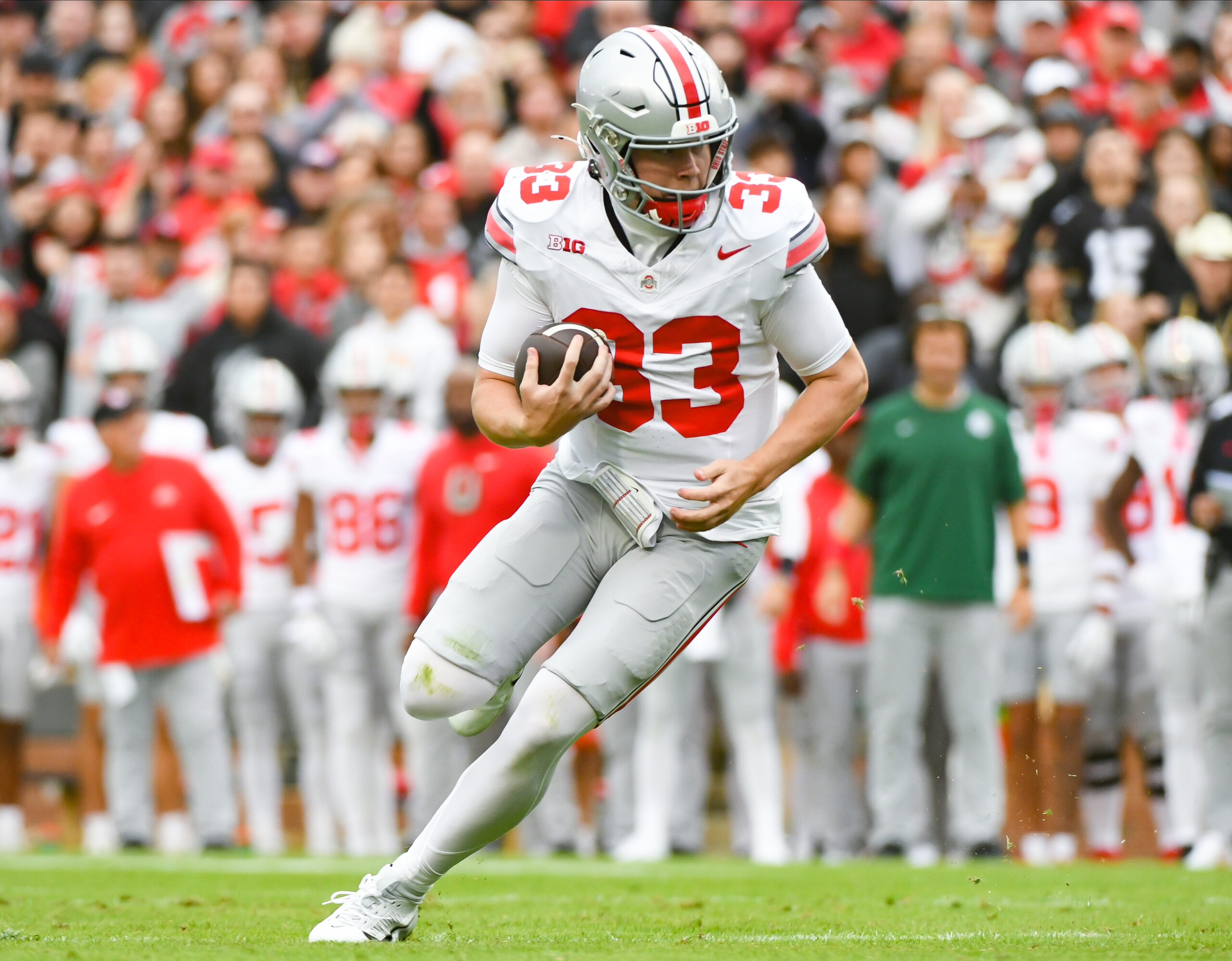Oct 14, 2023; West Lafayette, Indiana, USA; Ohio State Buckeyes quarterback Devin Brown (33) runs for a touchdown during the first half at Ross-Ade Stadium.