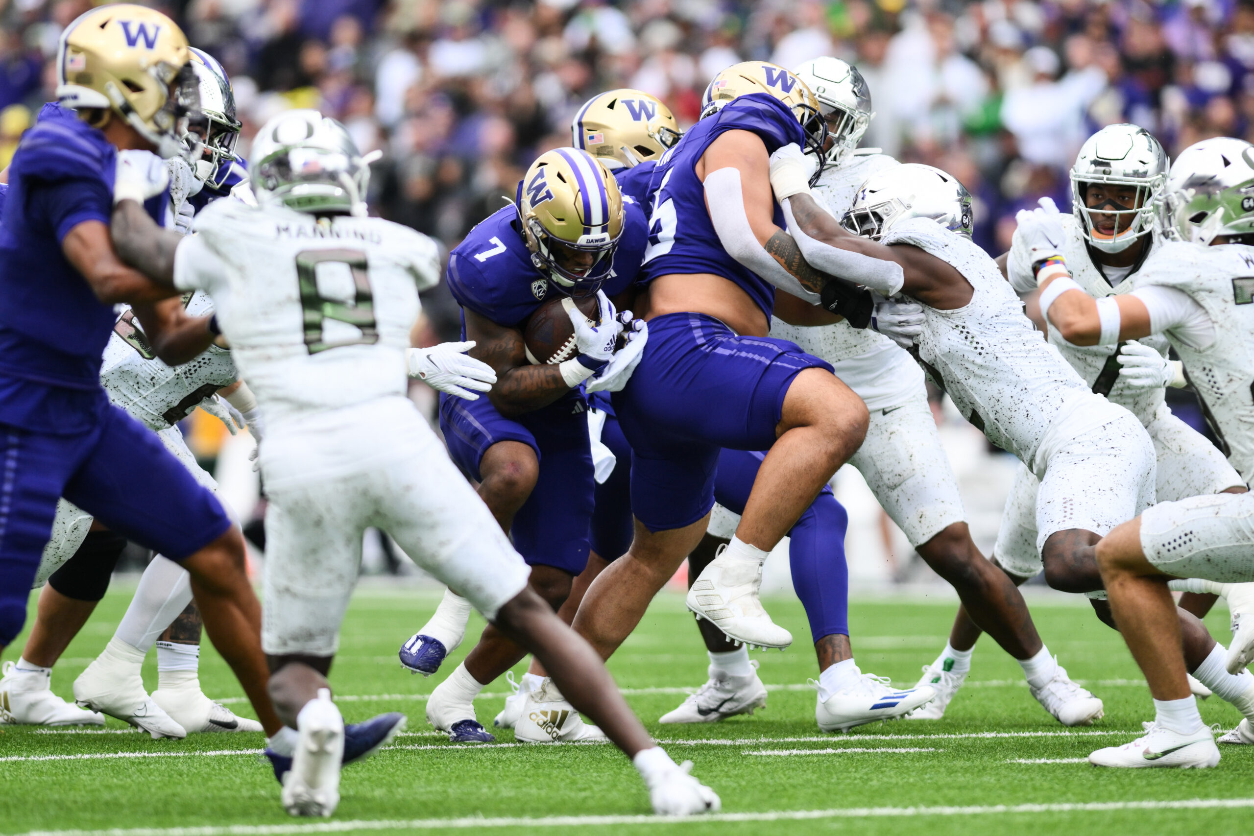 Oct 14, 2023; Seattle, Washington, USA; Washington Huskies running back Dillon Johnson (7) carries the ball against the Oregon Ducks during the first half at Alaska Airlines Field at Husky Stadium.