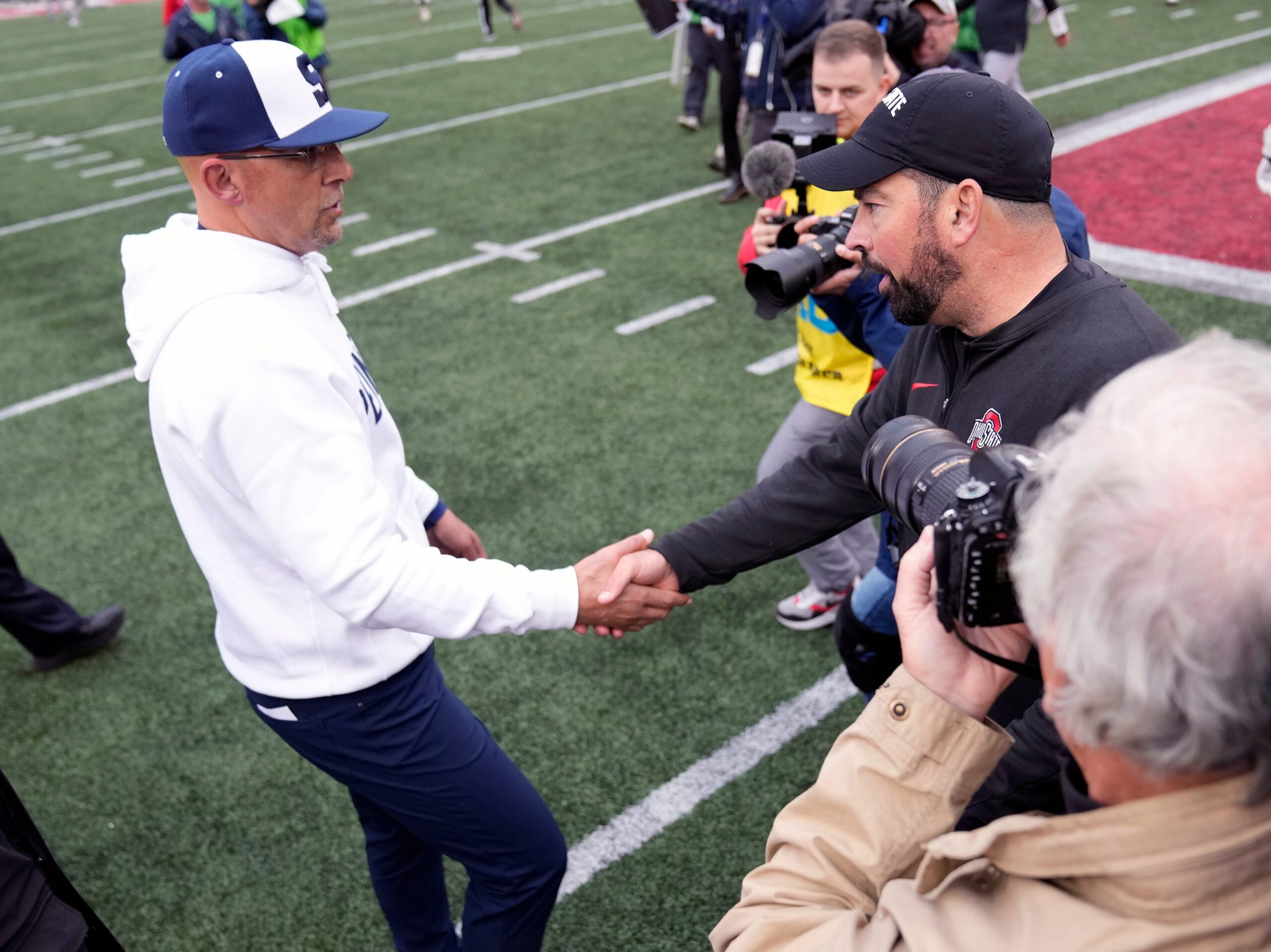 Oct 21, 2023; Columbus, Ohio, USA; Ohio State Buckeyes head coach Ryan Day meets Penn State Nittany Lions head coach James Franklin after the Buckeyes won 20-12 at Ohio Stadium.