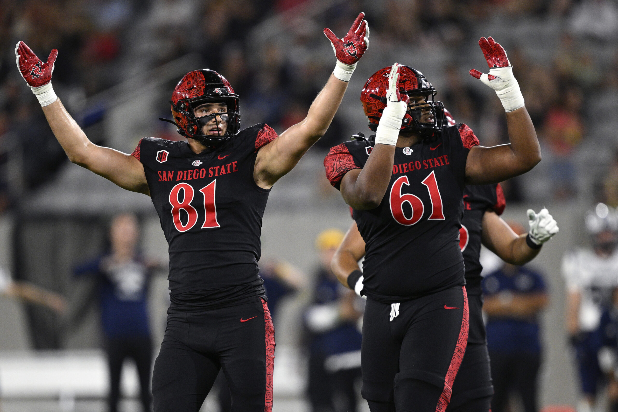 Oct 21, 2023; San Diego, California, USA; San Diego State Aztecs tight end Mark Redman (81) and offensive lineman Brandon Crenshaw-Dickson (61) react during a missed field goal against the Nevada Wolf Pack during the first half at Snapdragon Stadium. Mandatory Credit: Orlando Ramirez-USA TODAY Sports