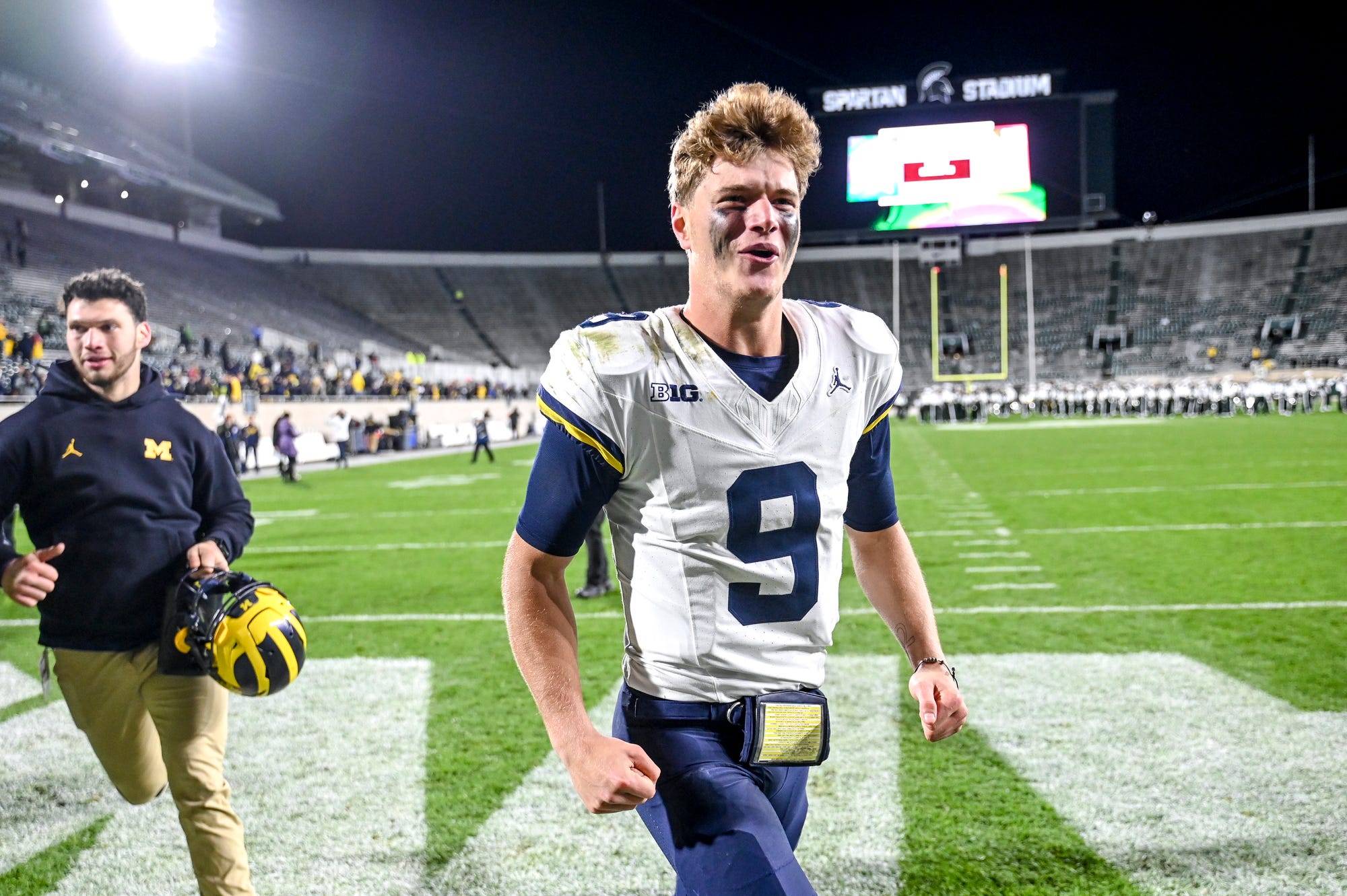 Michigan's quarterback J.J. McCarthy celebrates after beating Michigan State.