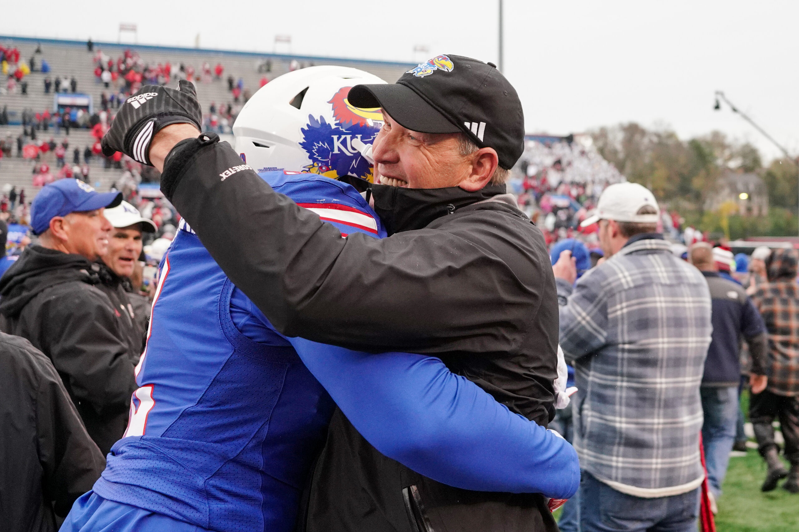 Oct 28, 2023; Lawrence, Kansas, USA; Kansas Jayhawks head coach Lance Leipold hugs a player after the win over the Oklahoma Sooners at David Booth Kansas Memorial Stadium.
