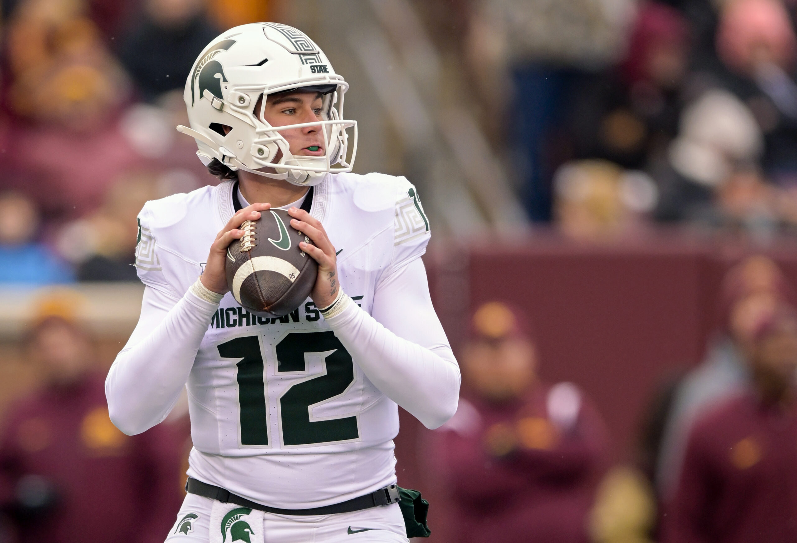 Oct 28, 2023; Minneapolis, Minnesota, USA; Michigan State Spartans quarterback Katin Houser (12) looks to pass against the Minnesota Golden Gophers during the second quarter at Huntington Bank Stadium. Mandatory Credit: Nick Wosika-USA TODAY Sports