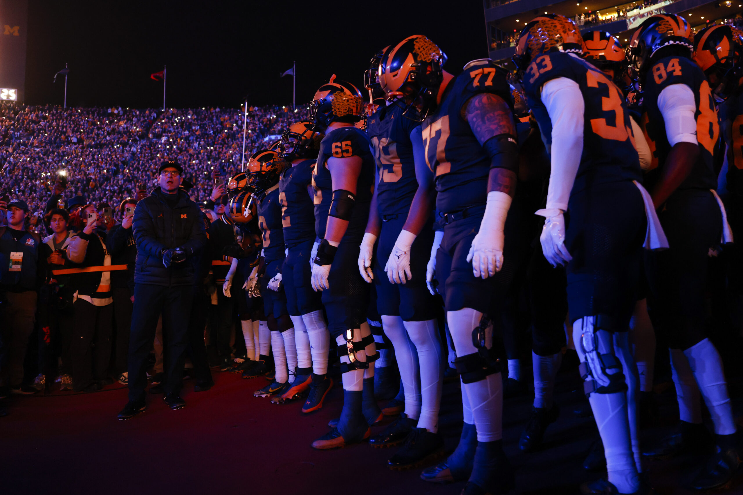 Nov 4, 2023; Ann Arbor, Michigan, USA; Michigan Wolverines head coach Jim Harbaugh gets set to run onto the field with his team before the game against the Purdue Boilermakers at Michigan Stadium. Mandatory Credit: Rick Osentoski-USA TODAY Sports