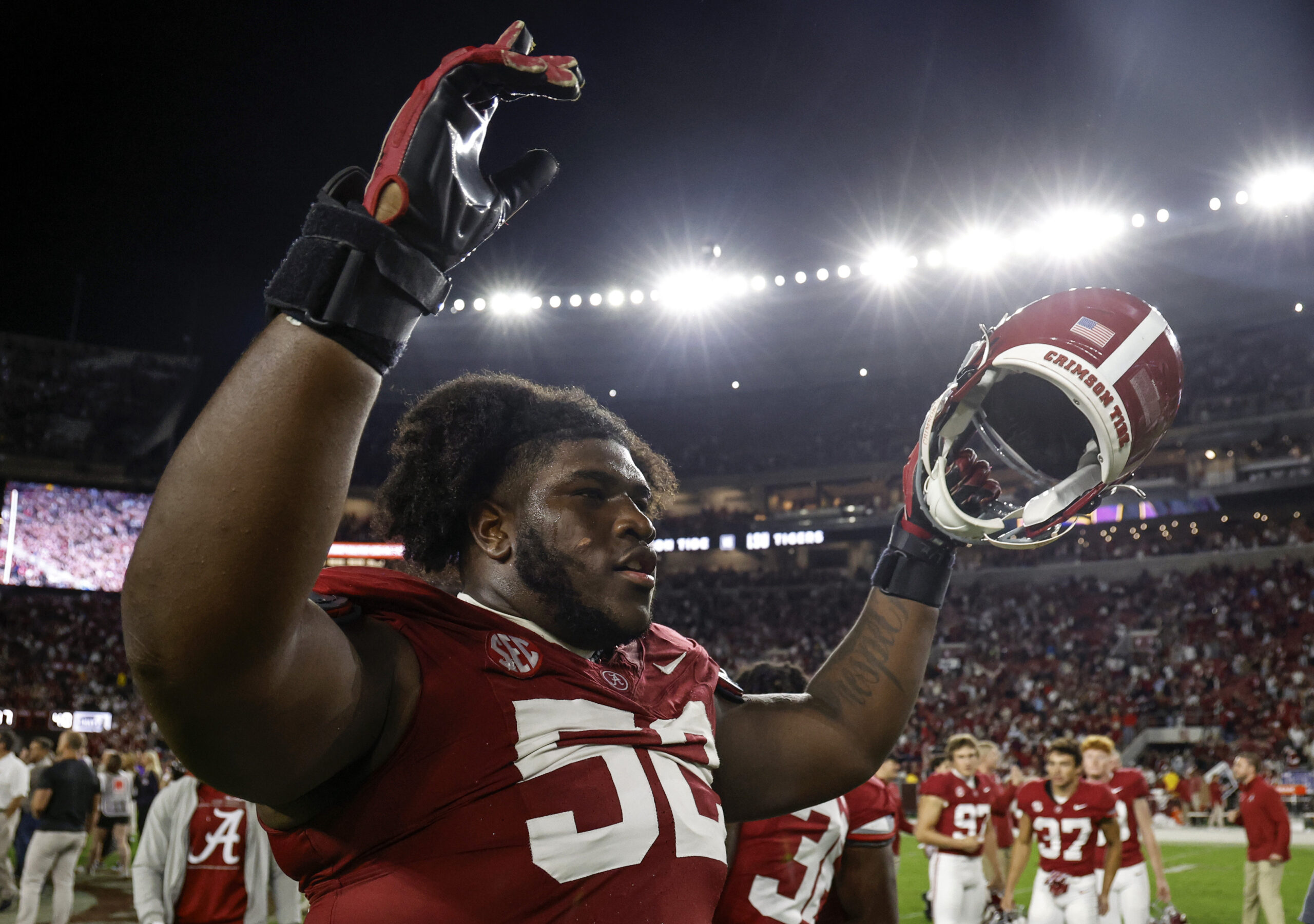 Nov 4, 2023; Tuscaloosa, Alabama, USA; Alabama Crimson Tide offensive lineman Tyler Booker (52) celebrates after defeating the LSU Tigers during the second half at Bryant-Denny Stadium. Mandatory Credit: Butch Dill-USA TODAY Sports
