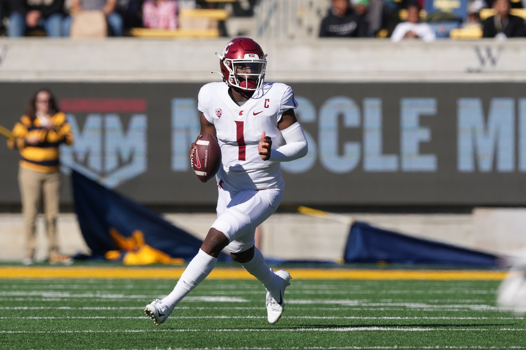 Nov 11, 2023; Berkeley, California, USA; Washington State Cougars quarterback Cameron Ward (1) rolls out against the California Golden Bears during the first quarter at California Memorial Stadium