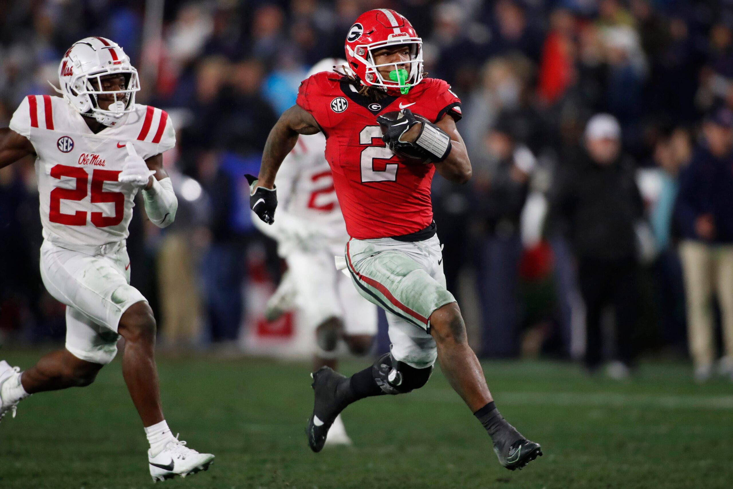 Georgia running back Kendall Milton (2) break away for a 51-yard gain during the second half of a NCAA college football game against Ole Miss in Athens, Ga., on Saturday, Nov. 11, 2023. Georgia won 52-17.