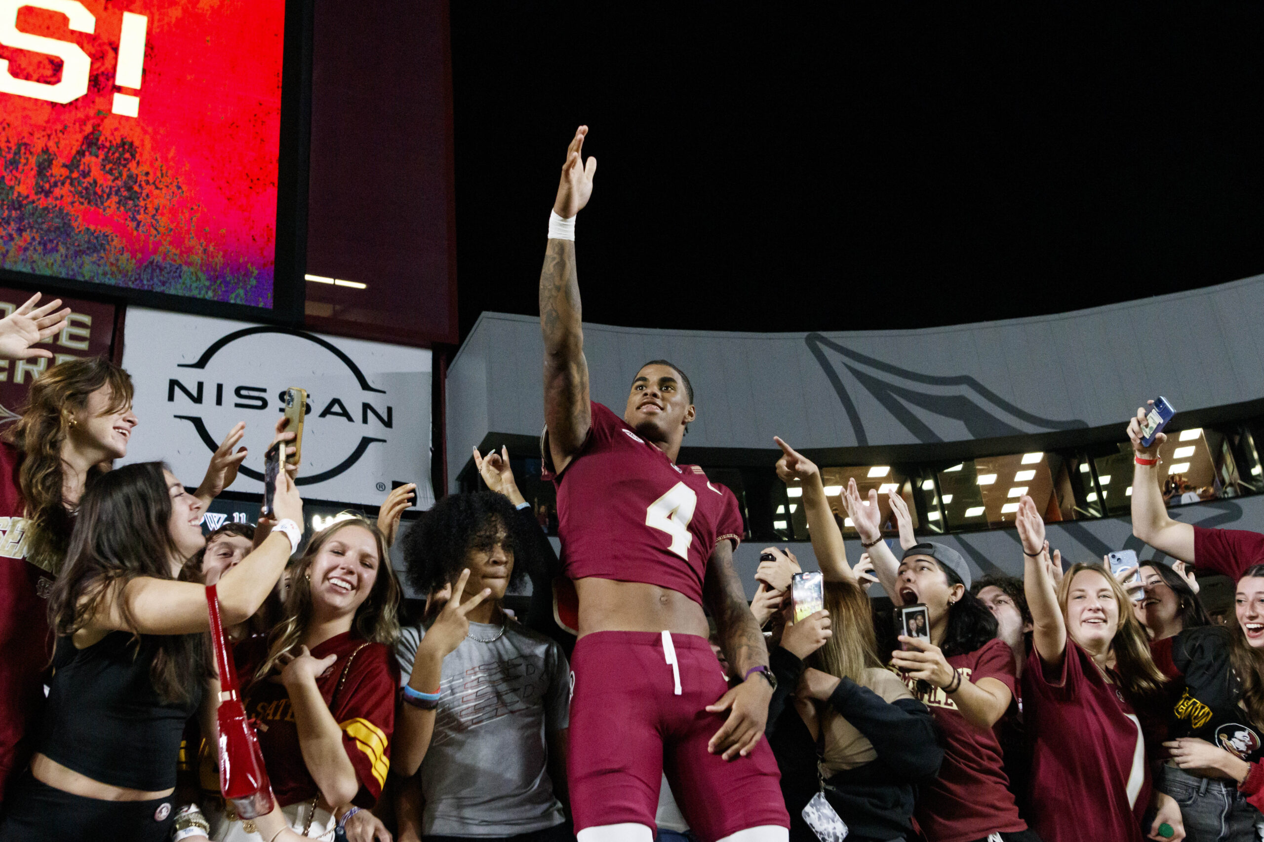 Nov 18, 2023; Tallahassee, Florida, USA; Florida State Seminoles wide receiver Keon Coleman (4) celebrates the win against the North Alabama Lions with fans at Doak S. Campbell Stadium.
