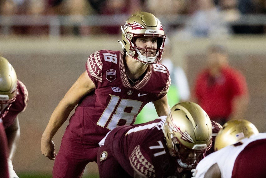 Florida State Seminoles quarterback Tate Rodemaker (18) talks to his teammates. The Florida State Seminoles defeated the Boston College Eagles 44-14 at Doak Campbell Stadium on Saturday, Sept. 24, 2022.