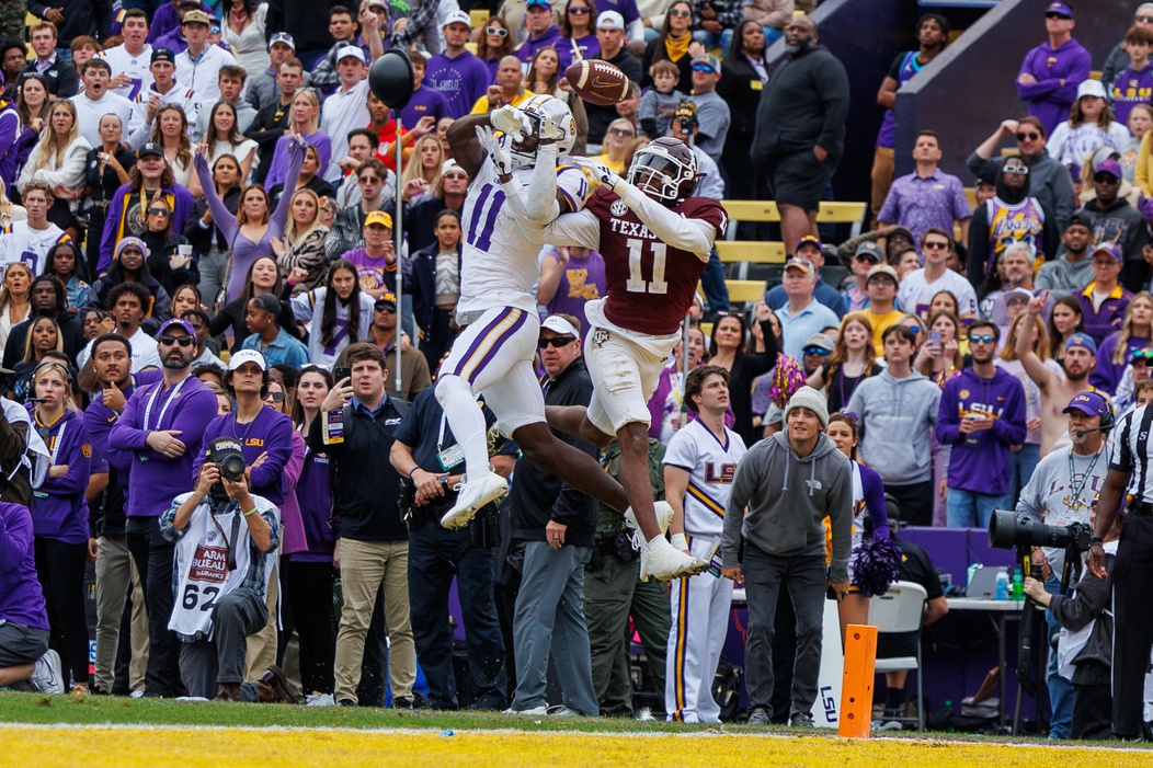 Nov 25, 2023; Baton Rouge, Louisiana, USA; LSU Tigers wide receiver Brian Thomas Jr. (11) has a pass deflected by Texas A&M Aggies defensive back Deuce Harmon (11) in the end zone during the second half at Tiger Stadium.