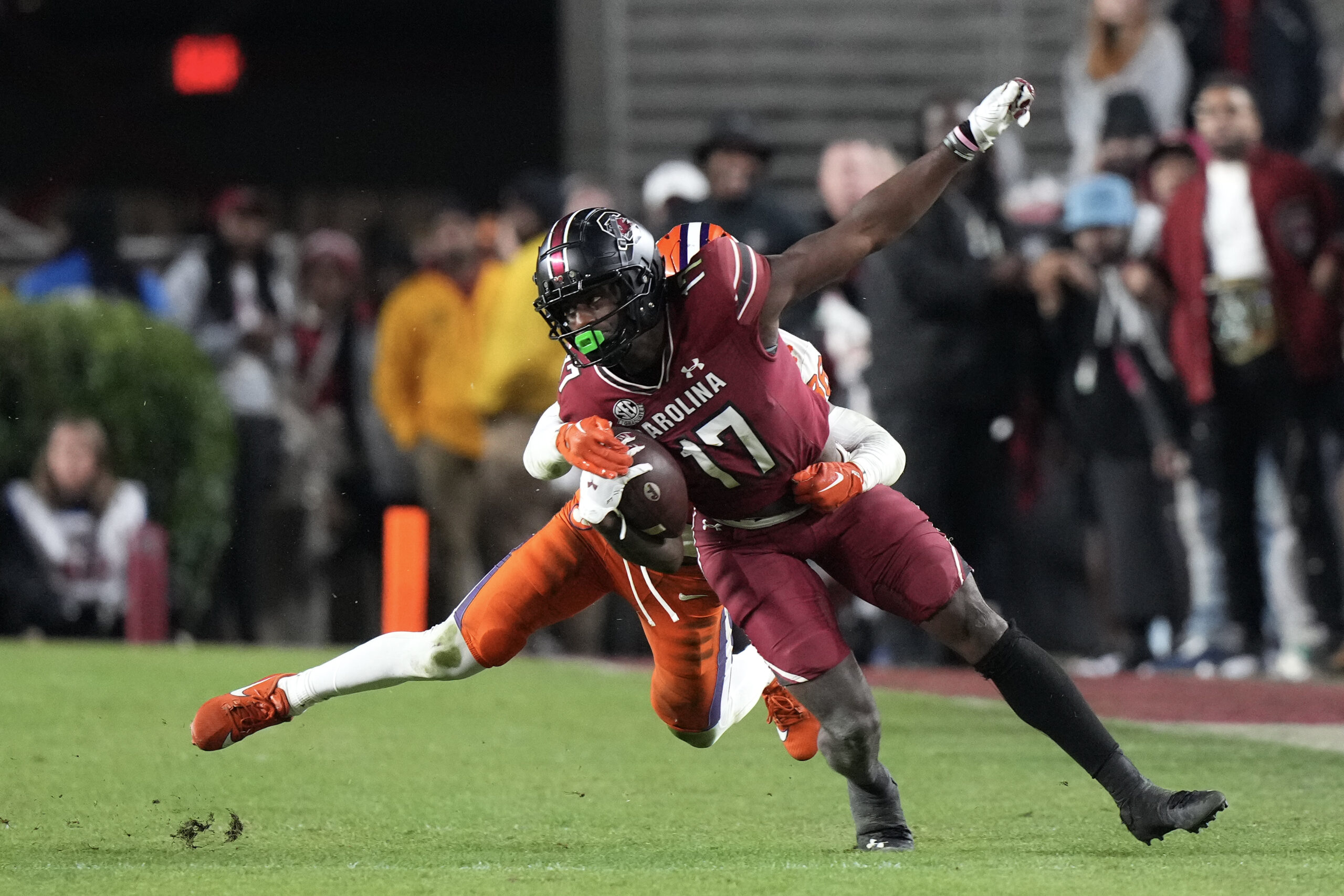 Nov 25, 2023; Columbia, South Carolina, USA; South Carolina Gamecocks wide receiver Xavier Legette (17) is tackled by Clemson Tigers safety Khalil Barnes (36) in the second half at Williams-Brice Stadium.