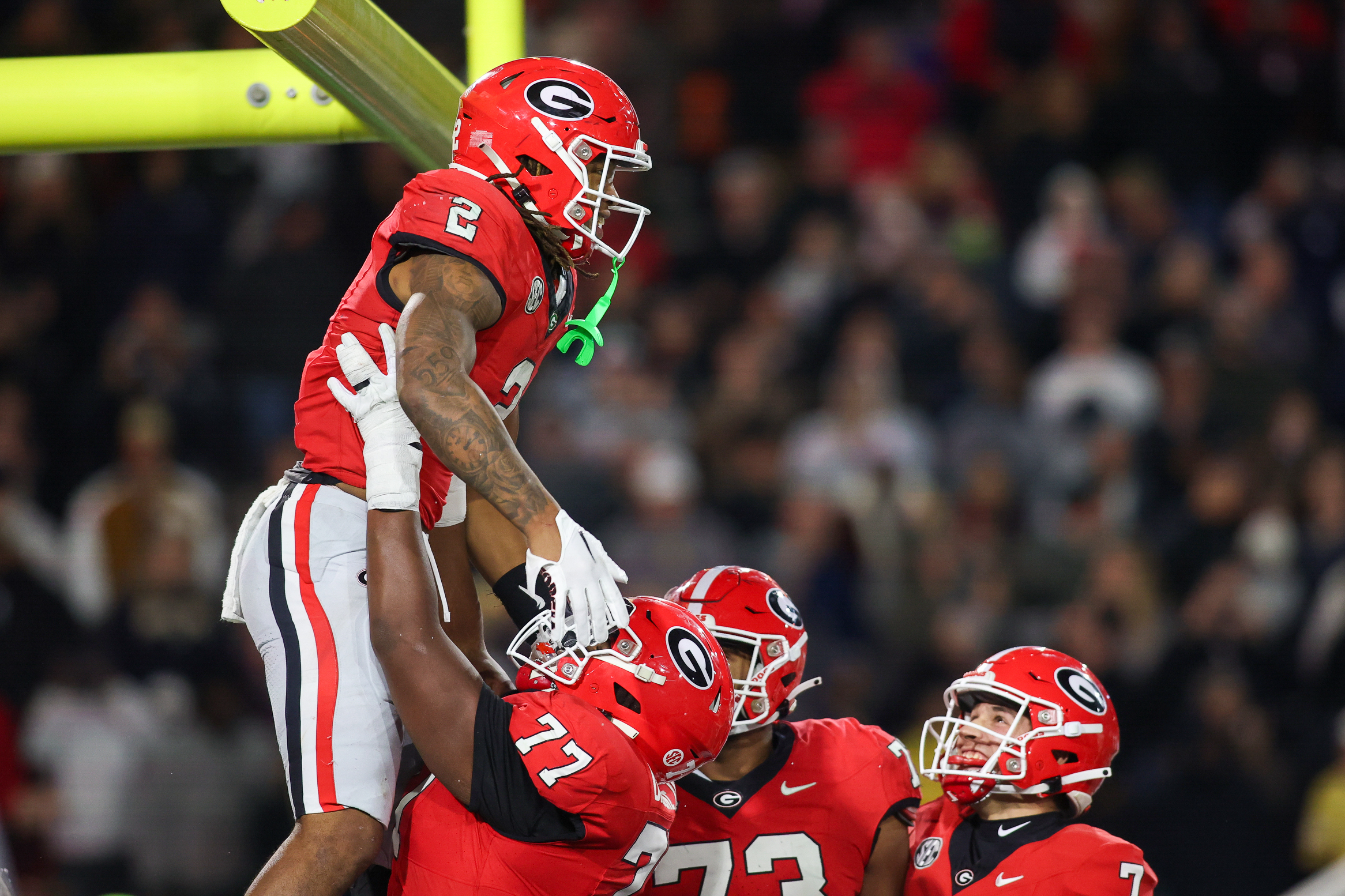Nov 25, 2023; Atlanta, Georgia, USA; Georgia Bulldogs running back Kendall Milton (2) celebrates with teammates after a touchdown against the Georgia Tech Yellow Jackets in the second half at Bobby Dodd Stadium at Hyundai Field.