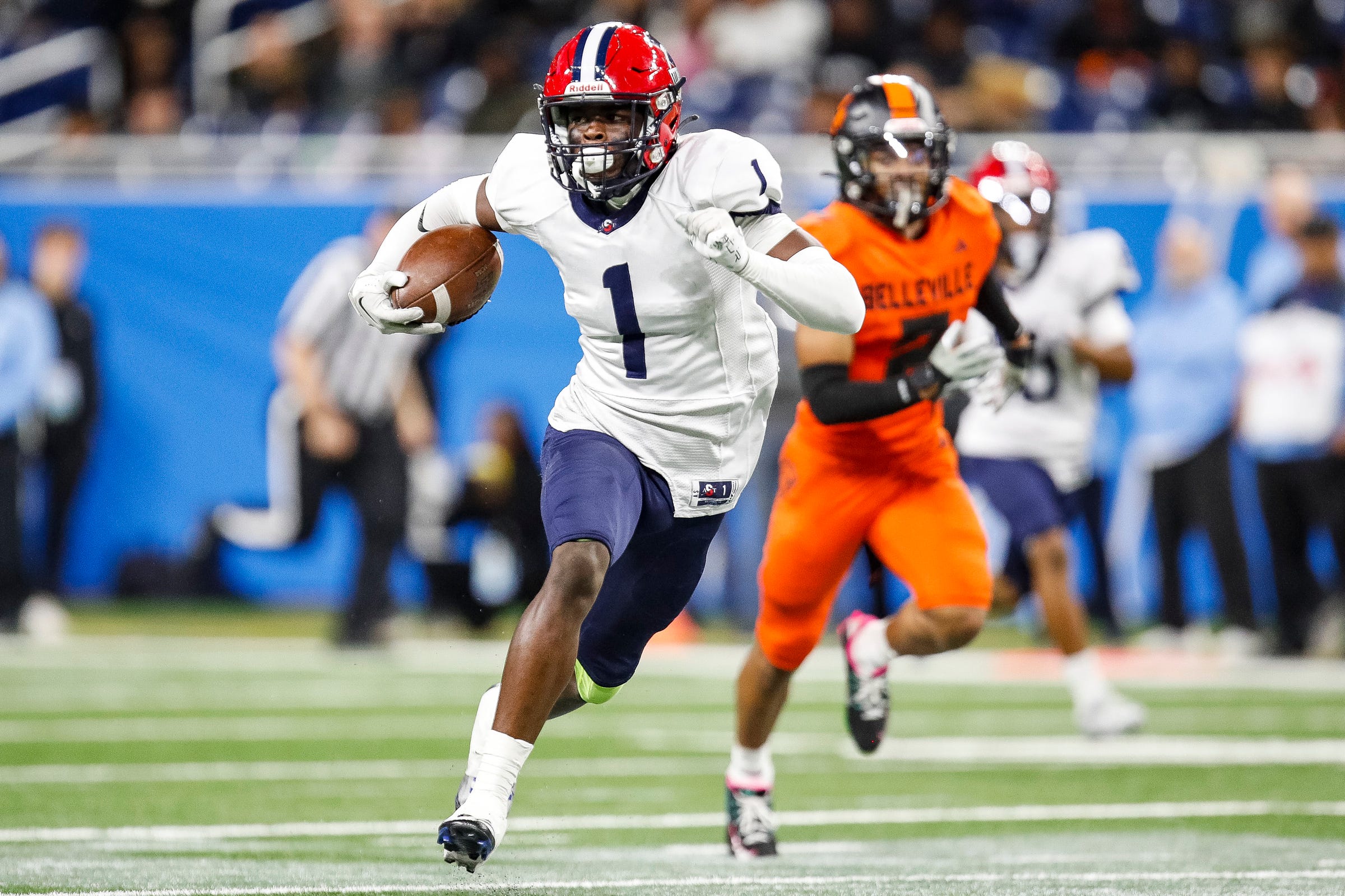 Southfield A&T wide receiver Tashi Braceful runs for a touchdown against Belleville during the first half of the Division 1 state final at Ford Field in Detroit on Sunday, Nov. 26, 2023.