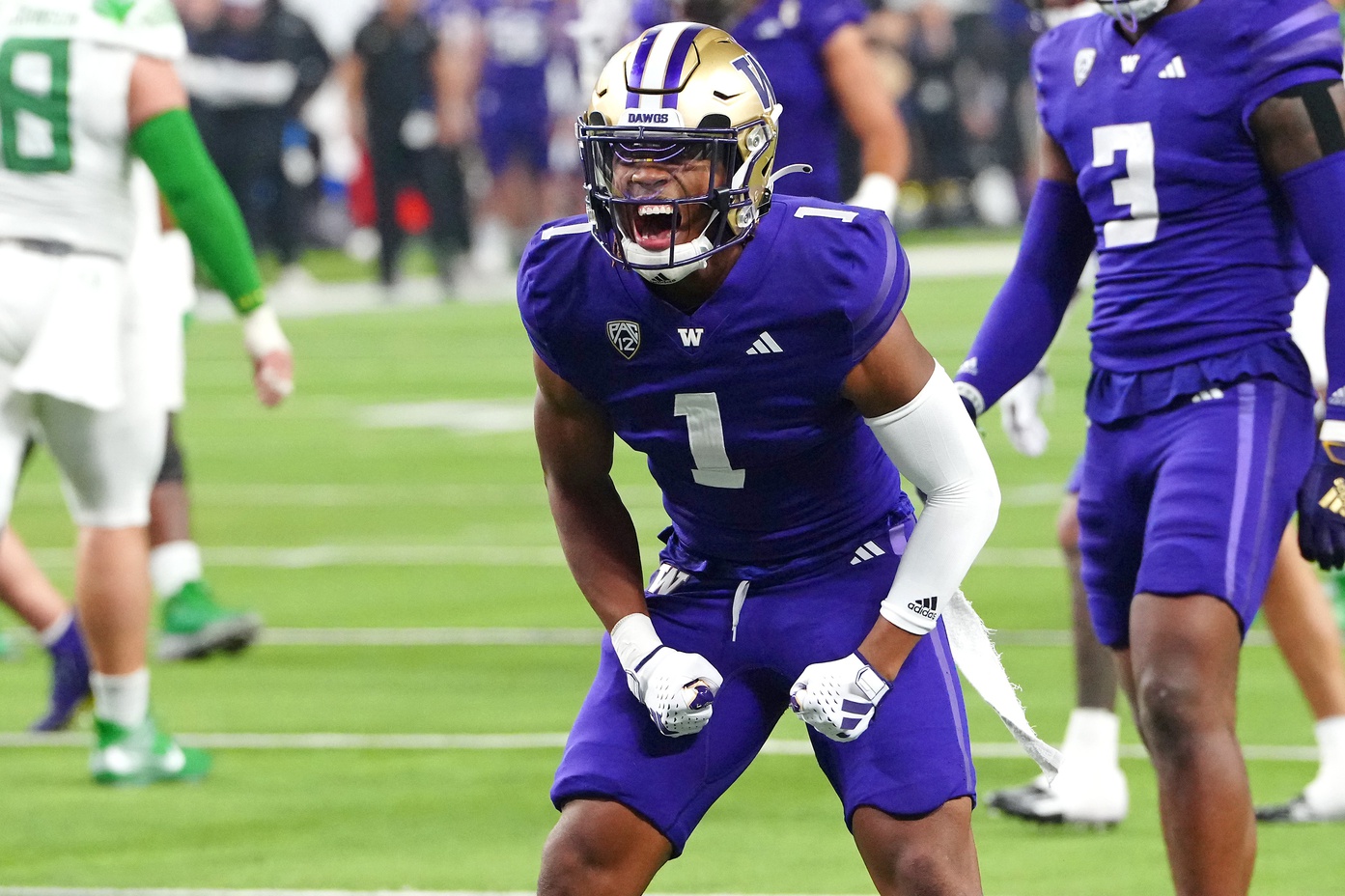 Dec 1, 2023; Las Vegas, NV, USA; Washington Huskies cornerback Jabbar Muhammad (1) celebrates after making a play against the Oregon Ducks during the second quarter at Allegiant Stadium.