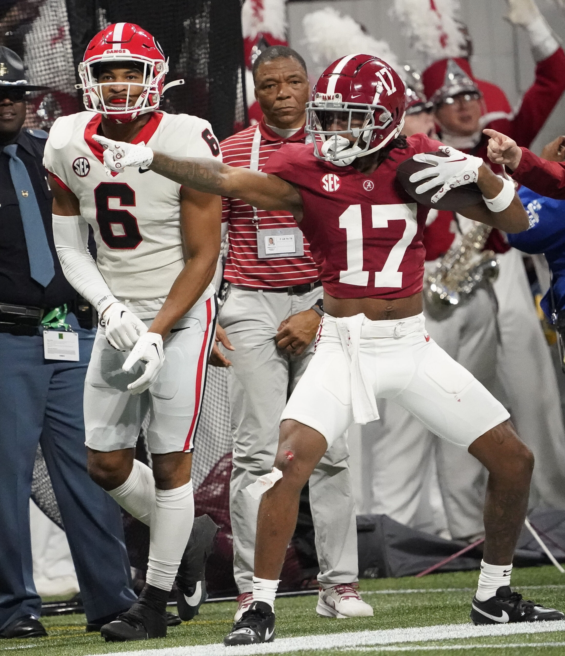 Dec 2, 2023; Atlanta, GA, USA; Alabama Crimson Tide wide receiver Isaiah Bond (17) celebrates after a first down catch as Georgia Bulldogs defensive back Daylen Everette (6) looks on at Mercedes-Benz Stadium.