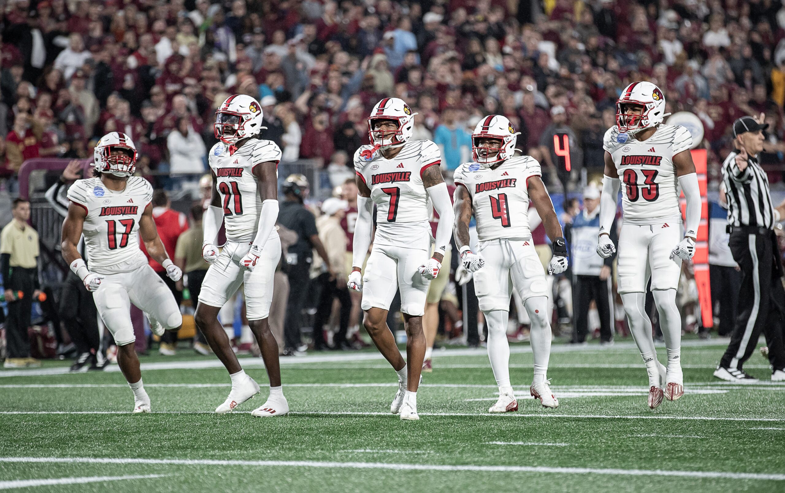The Louisville defense celebrated after sacking FSU punter Alex Mastromanno (29) as the Louisville Cardinals faced off against the Florida State Seminoles at Bank of America Field in Charlotte, NC. FSU defeated Louisville 16-6 to win the 2023 ACC Championship. Dec. 2, 2023.