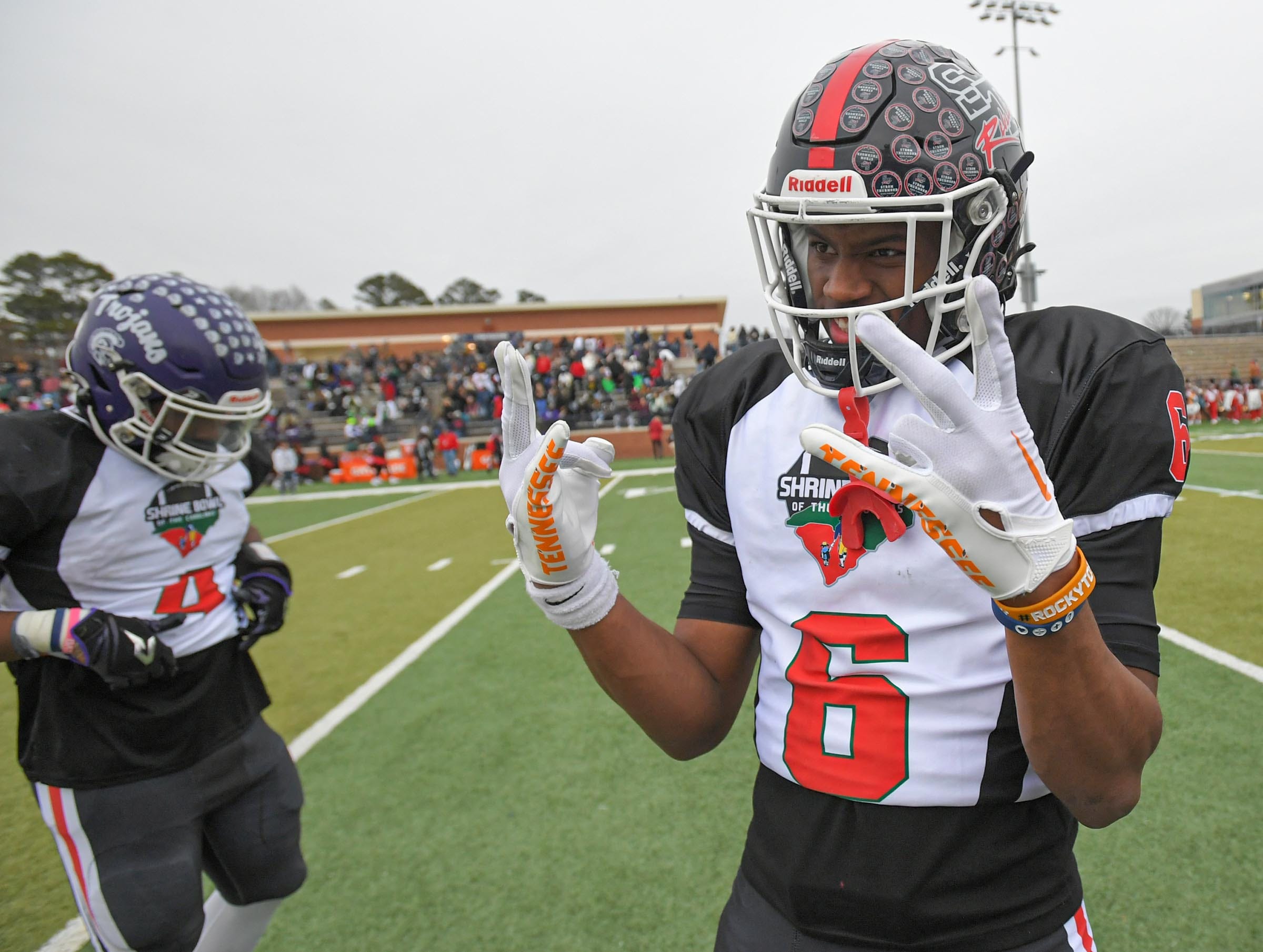 South Carolina receiver Braylon Staley of Strom Thurmond High, Tennessee commit, celebrates near North Carolina running back running back Cuttler Adams of Robbinsville High after the Shrine Bowl of the Carolinas football game at Viking Stadium in Spartanburg, S.C. Saturday, December 16, 2023. South Carolina won 24-0.