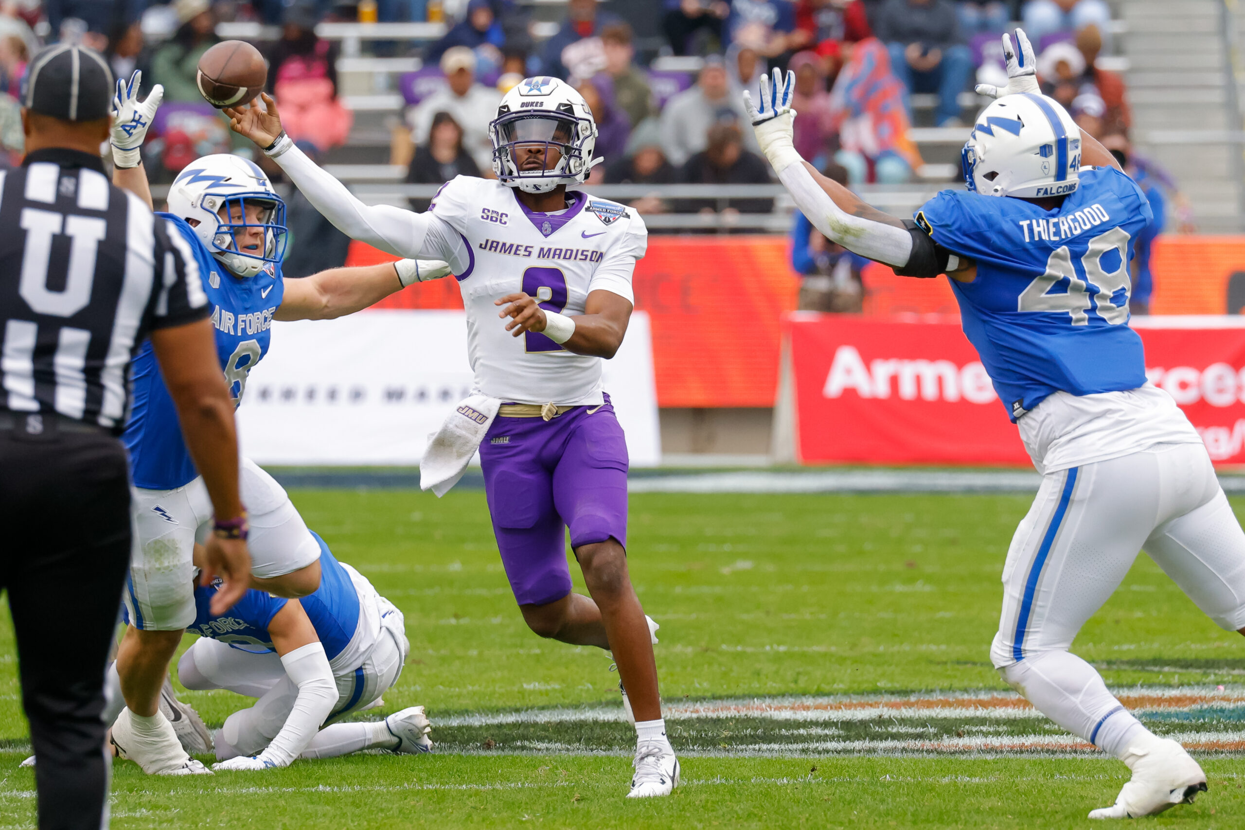Dec 23, 2023; Fort Worth, TX, USA; James Madison Dukes quarterback Jordan McCloud (2) throws while under pressure by the Air Force Falcons during the first quarter at Amon G. Carter Stadium.
