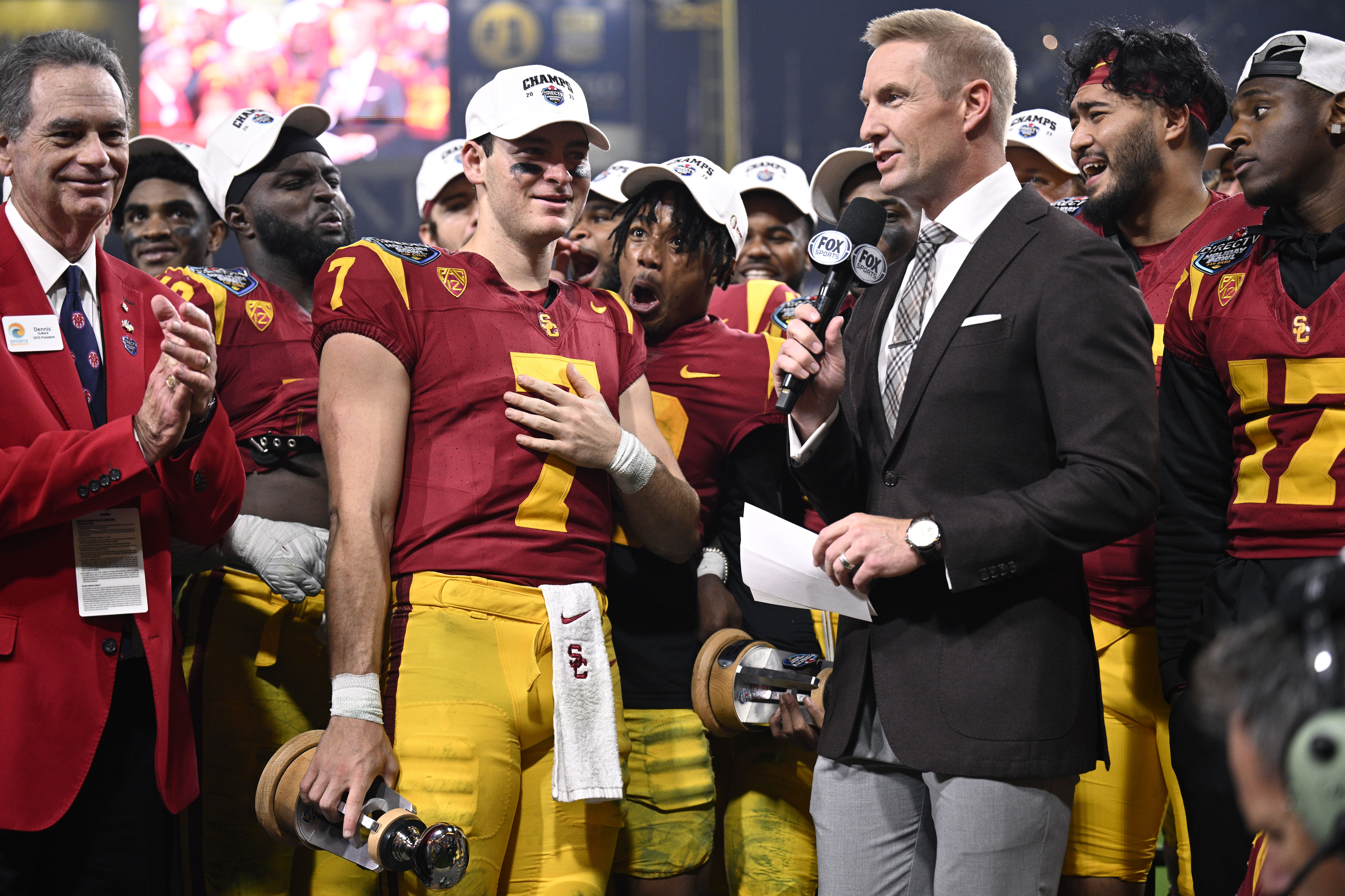 Dec 27, 2023; San Diego, CA, USA; USC Trojans quarterback Miller Moss (7) is presented the offensive MVP trophy after defeating the Louisville Cardinals at Petco Park.