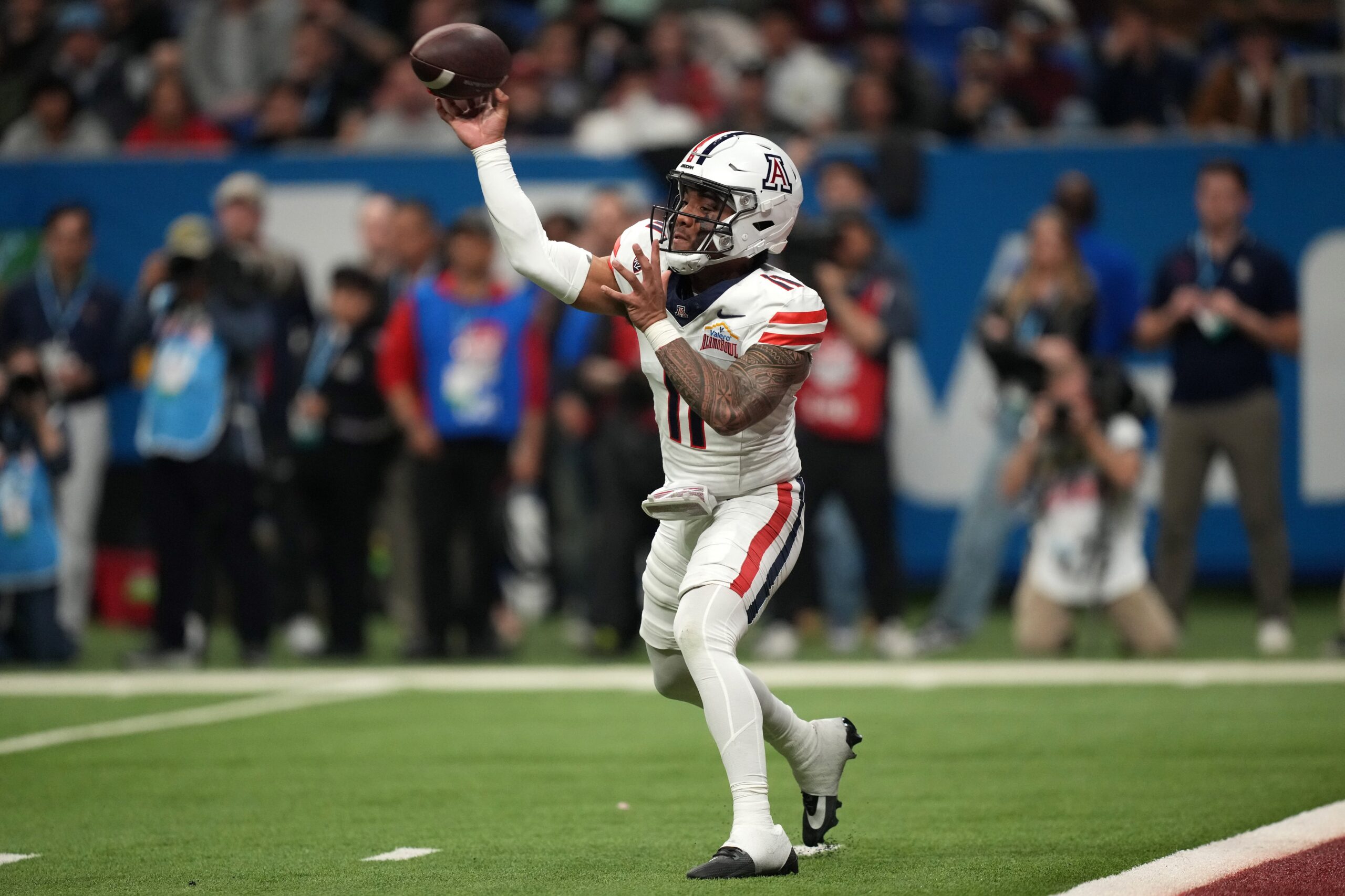 Dec 28, 2023; San Antonio, TX, USA; Arizona Wildcats quarterback Noah Fifita (11) throws the ball against the Oklahoma Sooners in the fist half of the Alamo Bowl at Alamodome.