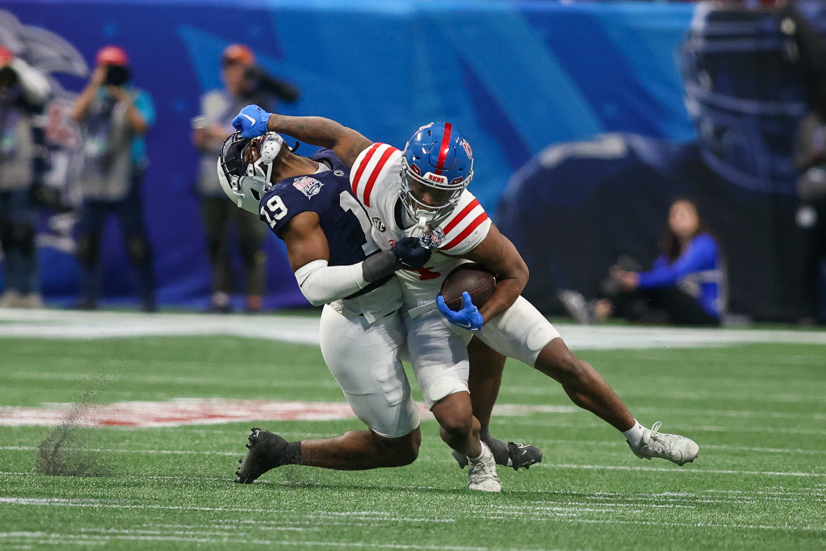 Dec 30, 2023; Atlanta, GA, USA; Mississippi Rebels running back Quinshon Judkins (4) stiff arms Penn State Nittany Lions defensive end Jameial Lyons (19) in the second half at Mercedes-Benz Stadium.