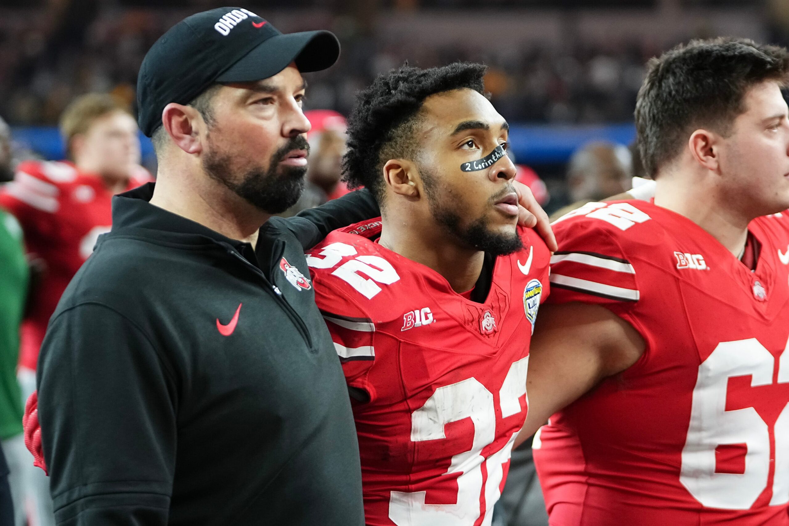 Dec 29, 2023; Arlington, Texas, USA; Ohio State Buckeyes head coach Ryan Day and running back TreVeyon Henderson (32) sing Carmen Ohio following their 14-3 loss to the Missouri Tigers in the Goodyear Cotton Bowl Classic at AT&T Stadium.